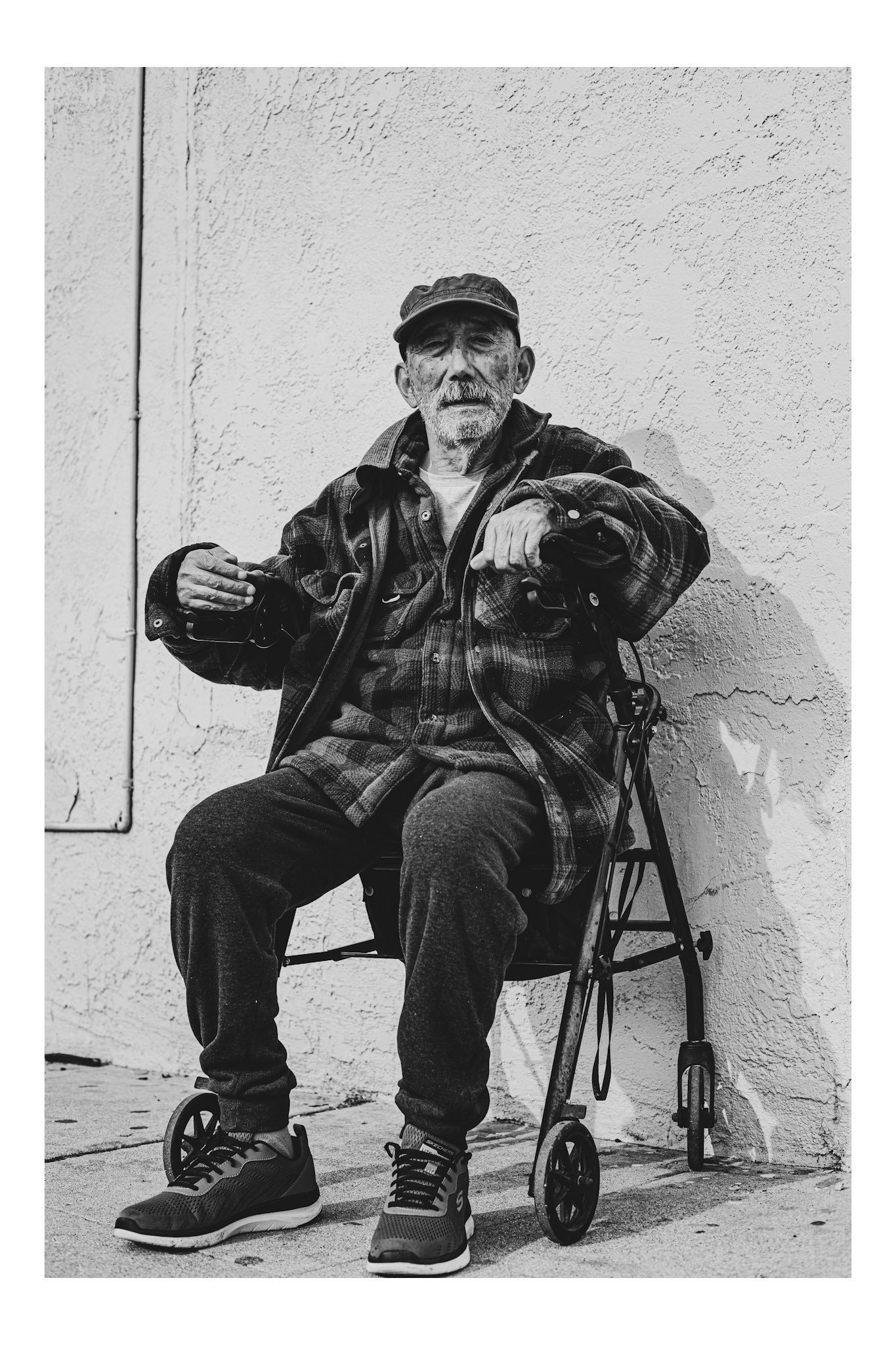 Old man poses in front of liquor store, Los Angeles, 2014
