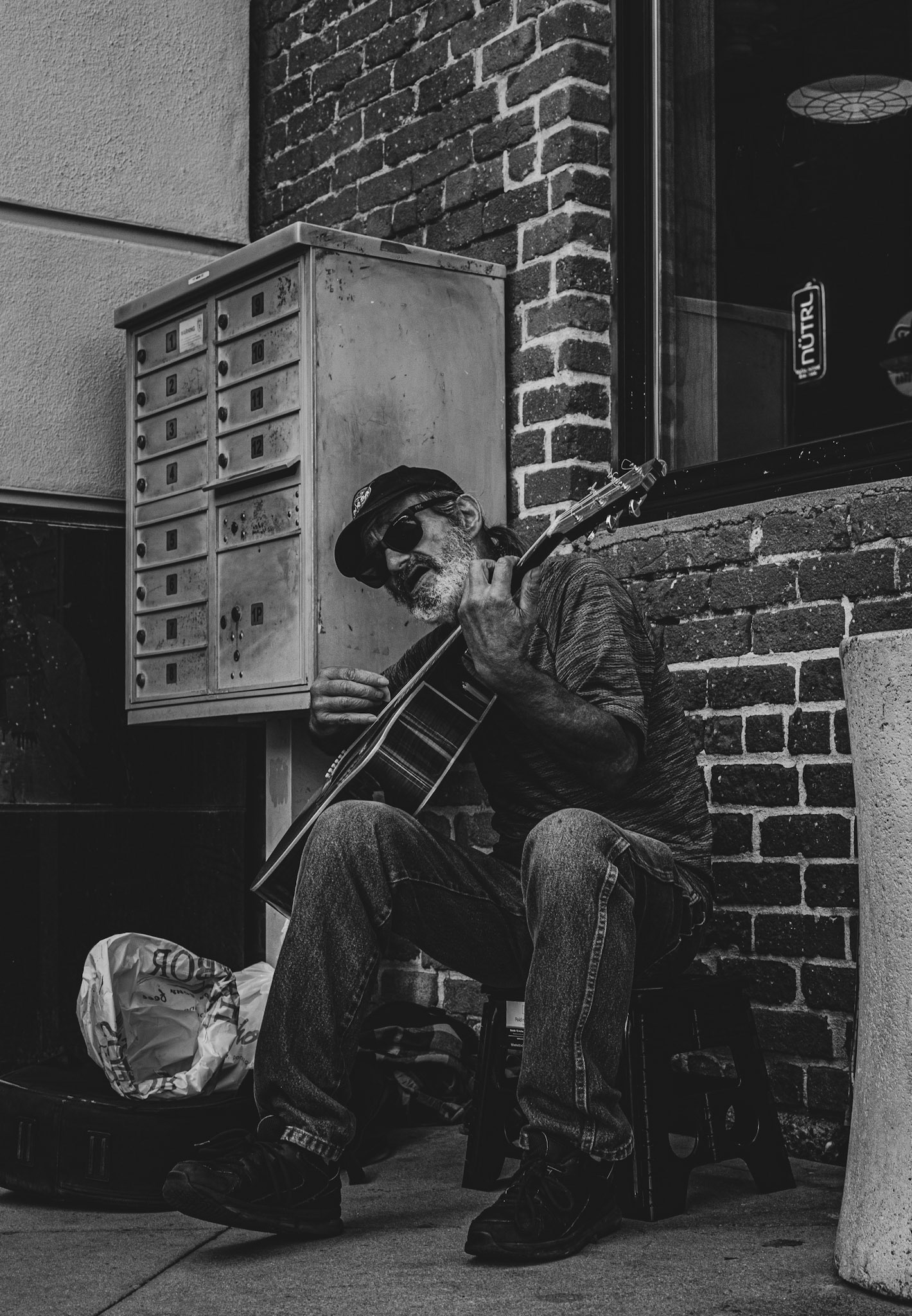 Homeless man playing his guitar on the streets of Venice Beach, Ca, 2014