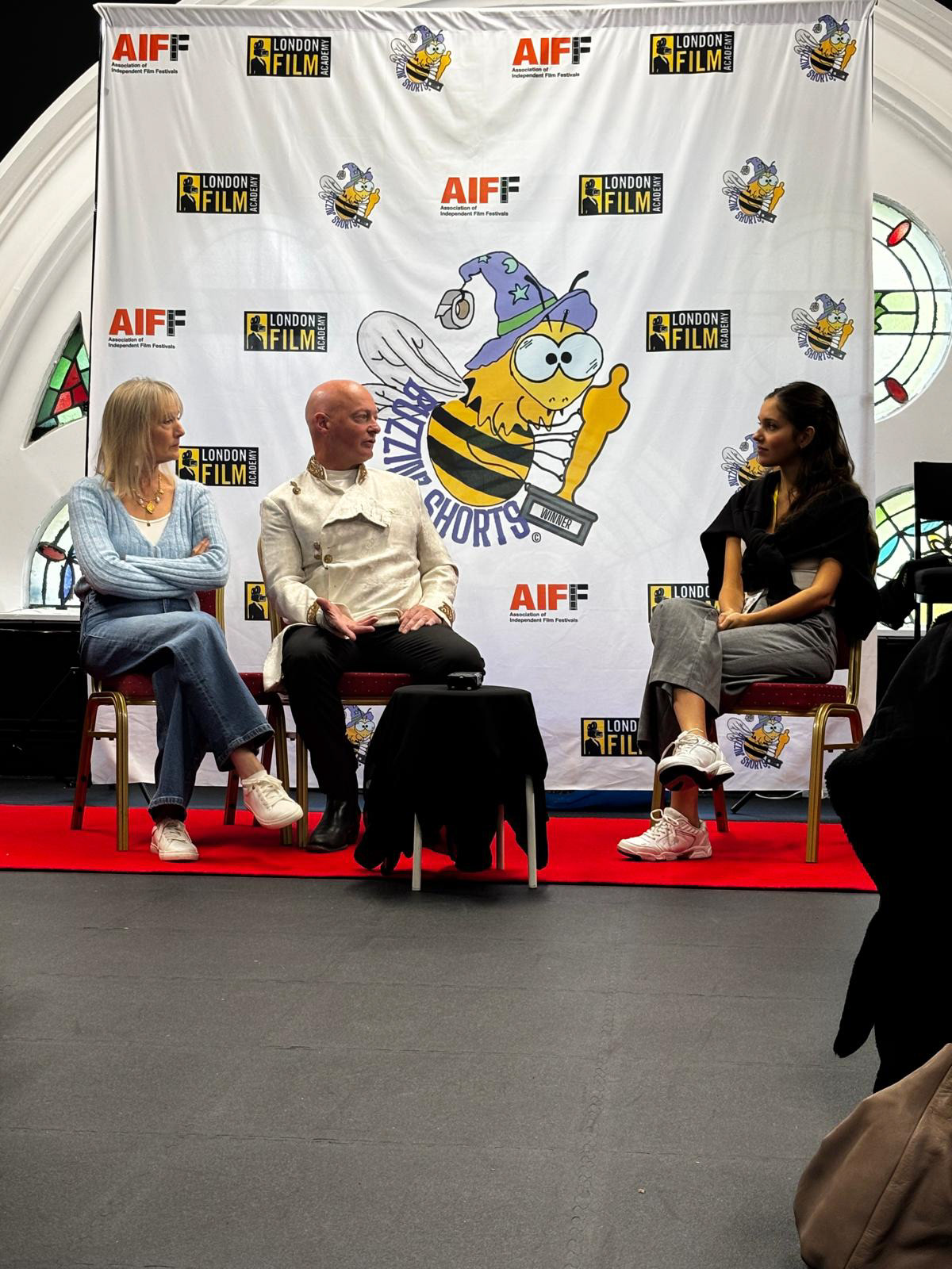 Josée Bekker hosting a guest panel with Adam Richards and Nicola Wright.
