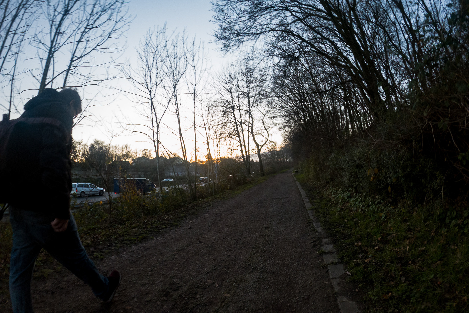 Passing a walker on a short stretch of dirt trail along the autobahn A40 on a newly discovered 10 km route near my parents' home. Mülheim, Germany, December 19, 2019.