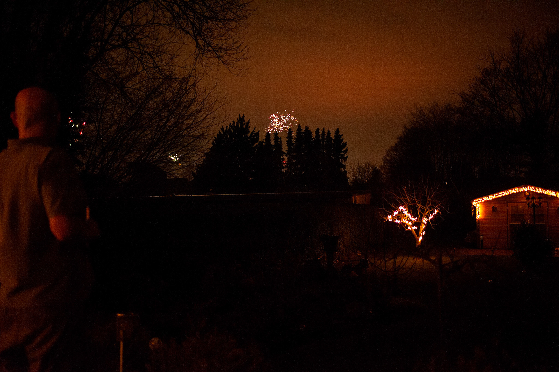 Christoph watches the New Year’s Eve fireworks from the patio. Oberhausen, Germany, January 1, 2023.