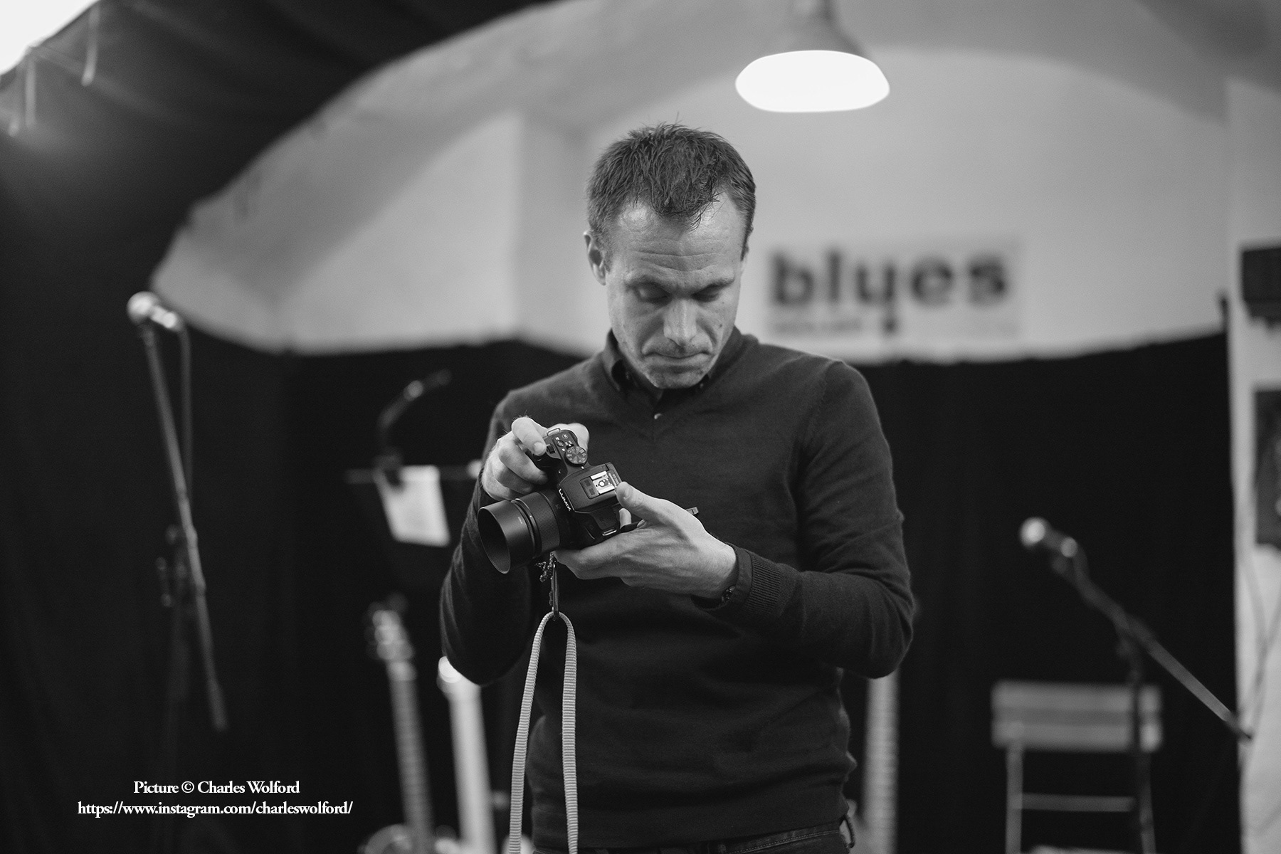 A snapshot from my time at a foreign correspondence workshop in Prague. Here, I am photographing the group at a blues concert. Prague, Czechia, July 2016. Picture by Charles Wolford.