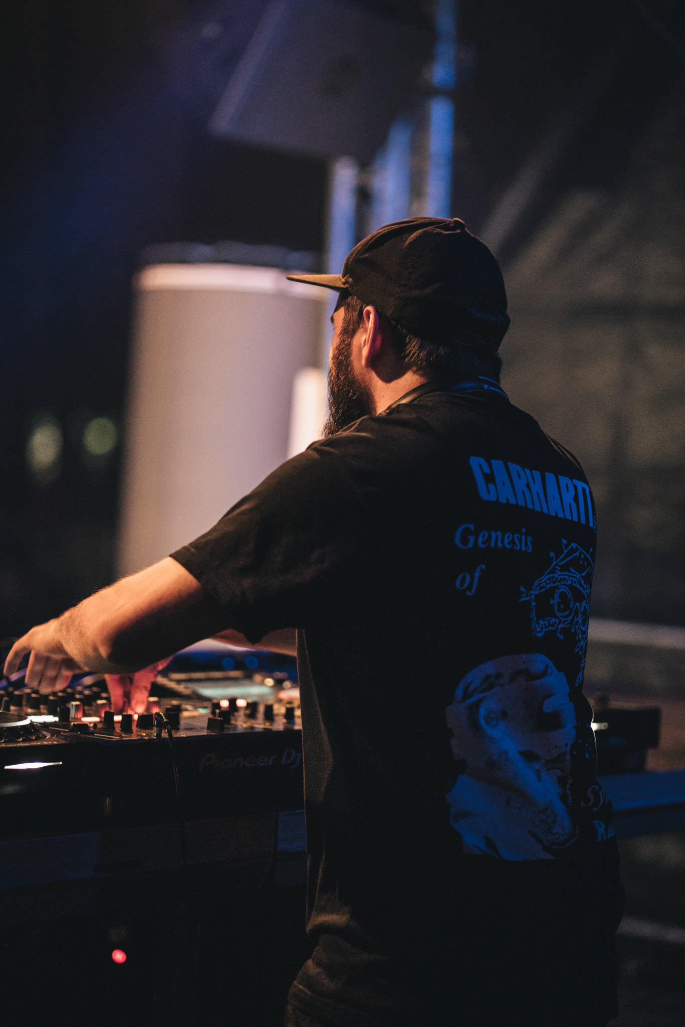 DJ Performance Night – Live DJ performance with dramatic stage lighting.
