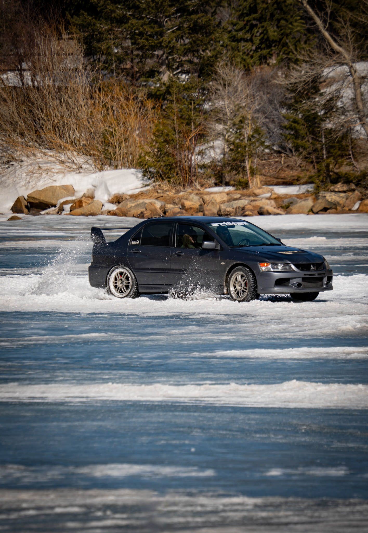 Winter Rally Action – Rally car drifting on a frozen lake in Colorado, US.