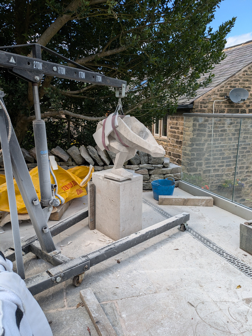 Setting the sculpture into the plinth recess