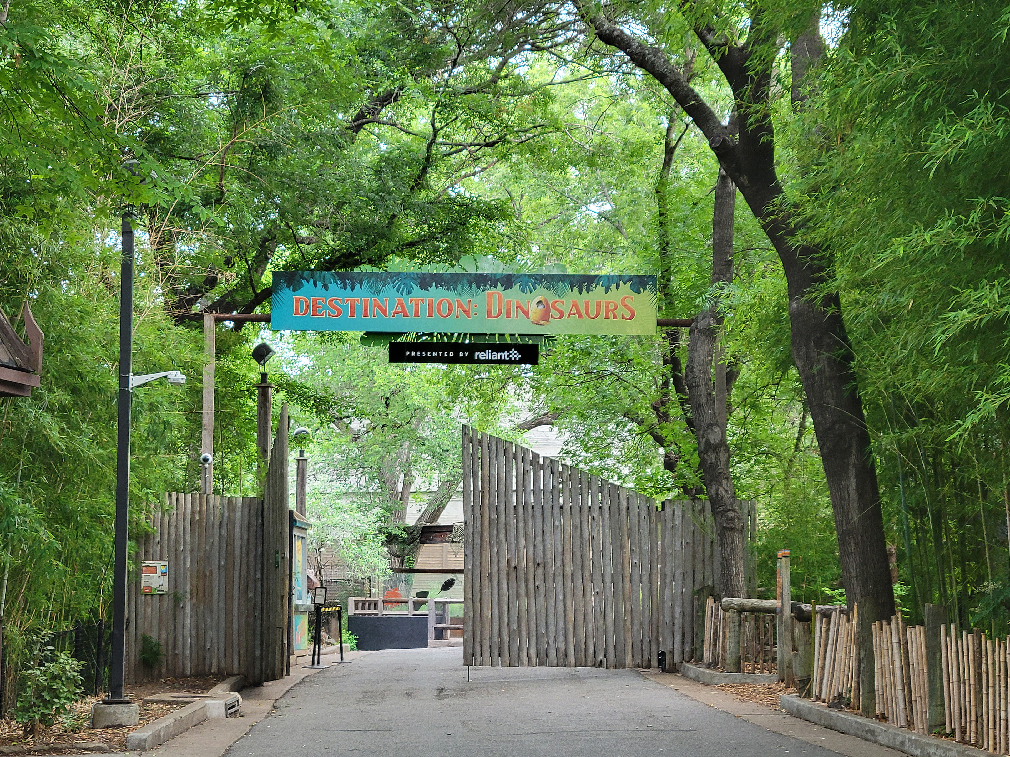 Large sign over the gate to clearly label the Destination: Dinosaurs entrance along with prominent sponsorship visibility