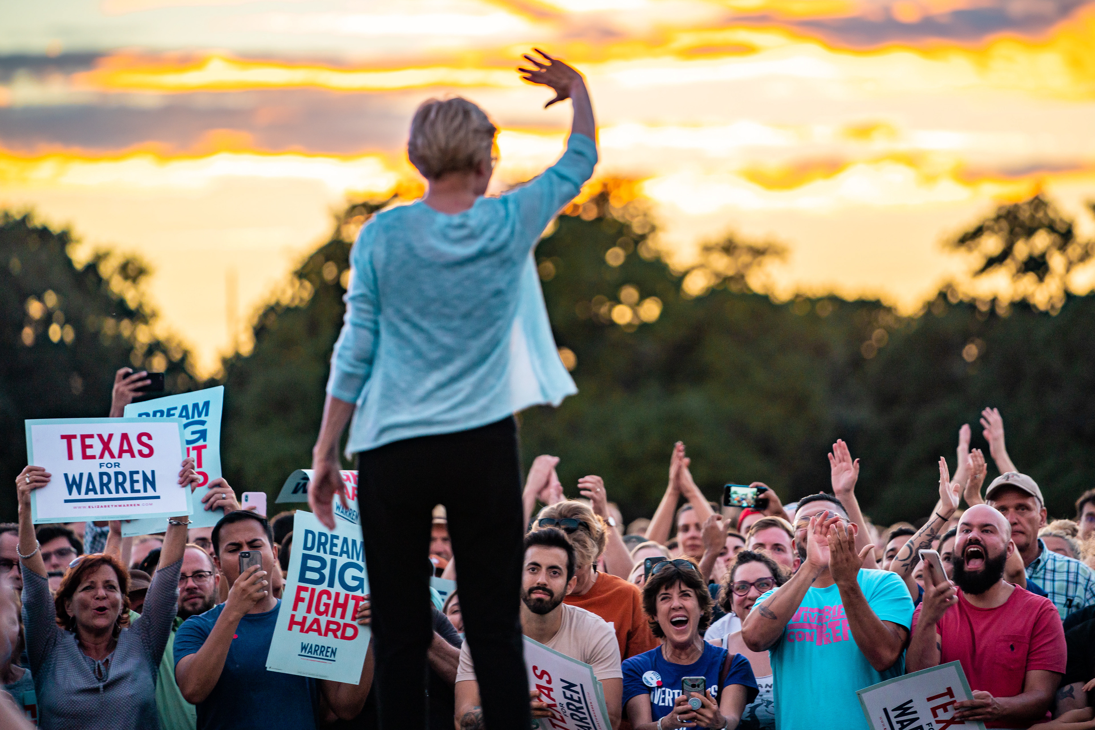 Senator Elizabeth Warren waves to a cheering crowd at the end of a town hall event on September 10, 2019 at Auditorium Shores in Austin, Texas.