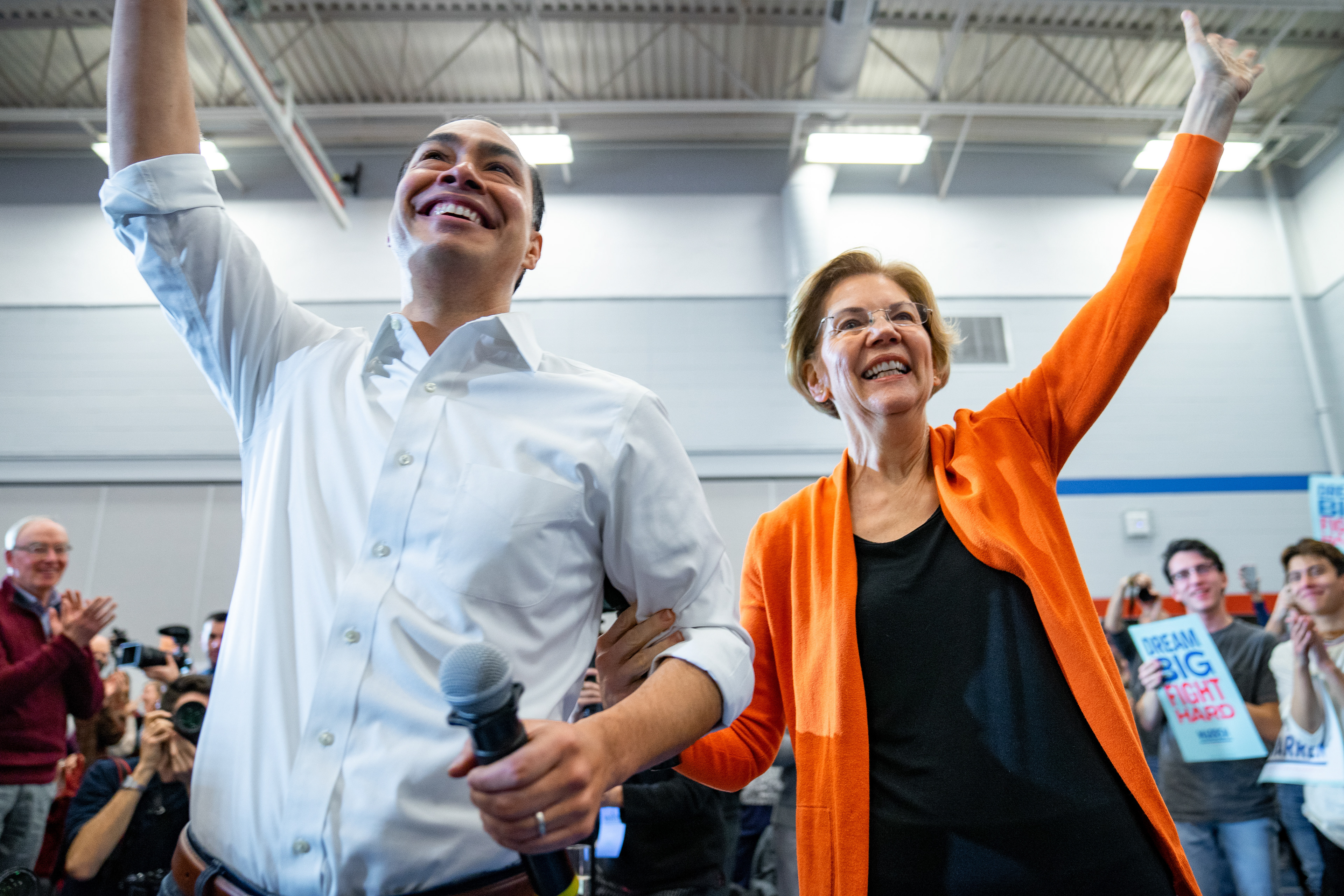 Senator Elizabeth Warren and Secretary Julián Castro wave to supporters during a town hall event on January 12, 2020 at Fisher Elementary School in Marshalltown, Iowa.
