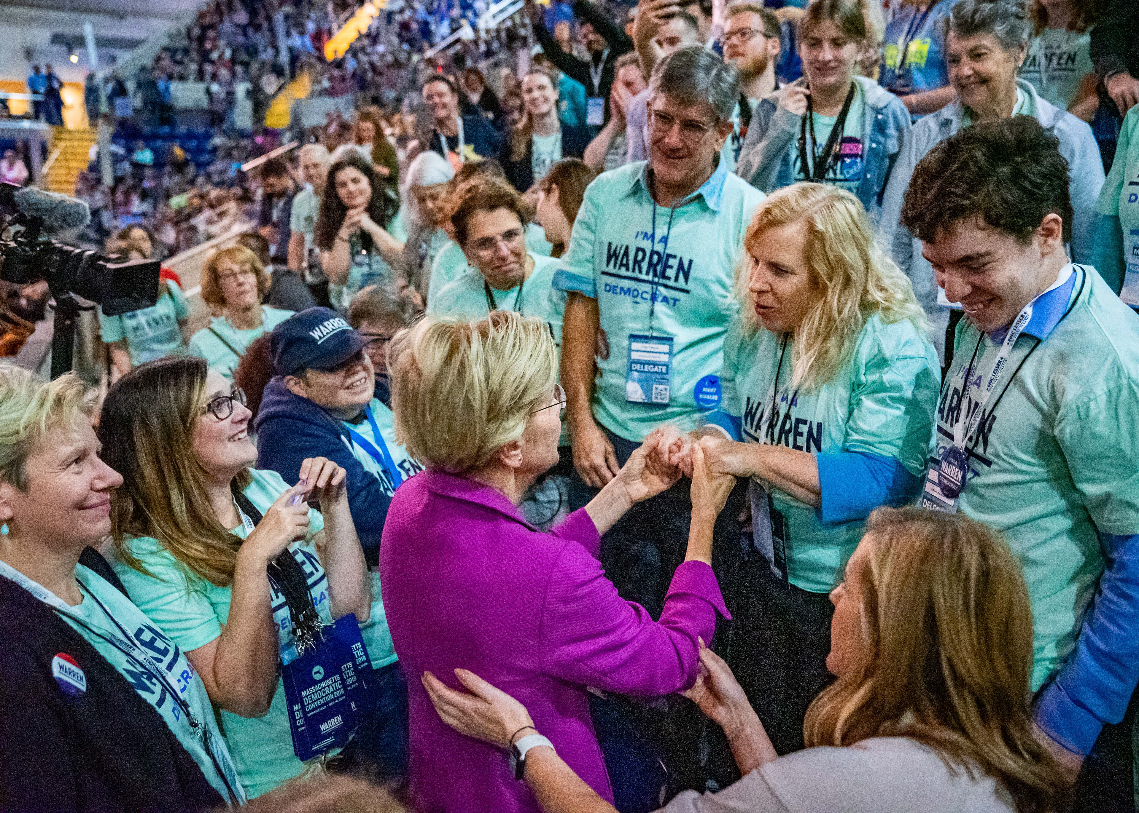 Senator Elizabeth Warren holds the hands of a local volunteer during the Massachusetts Democratic Convention held at the Mass Mutual Center on September 14, 2019 in Springfield, Massachusetts.