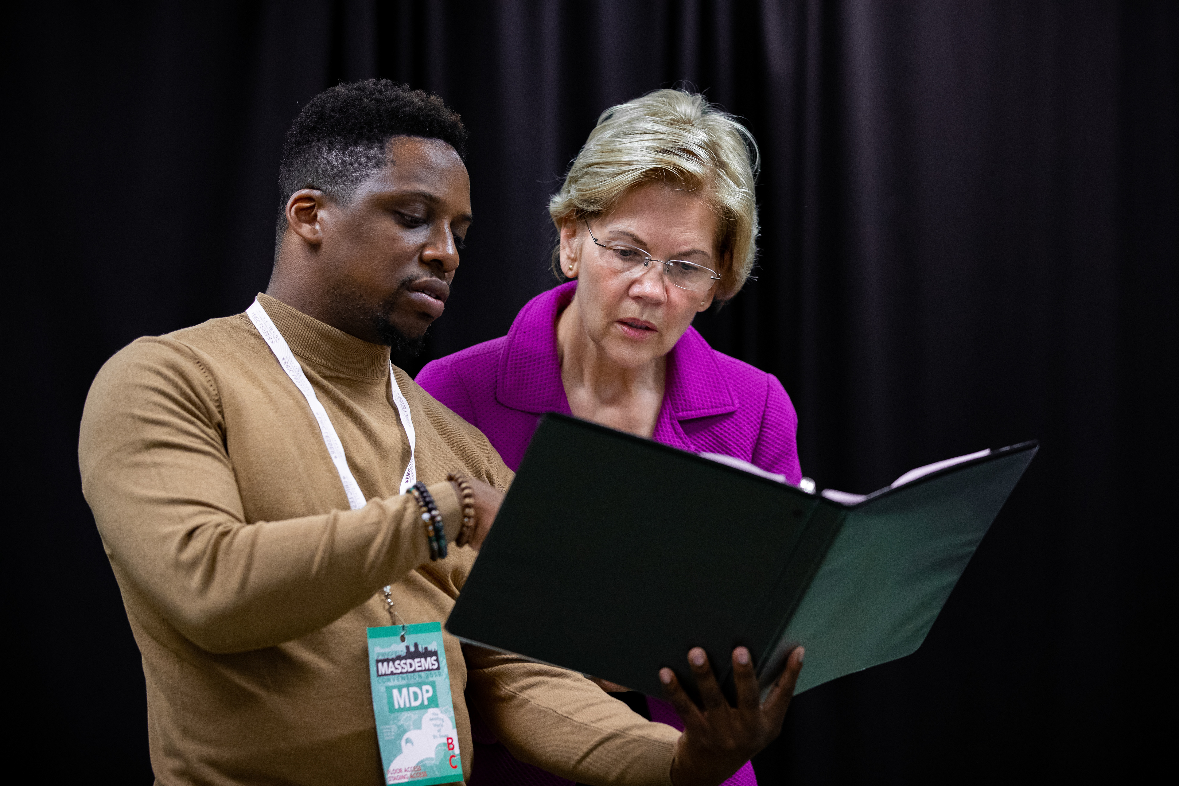 Senator Elizabeth Warren goes over her speech with her speech writer, Christopher Huntley, prior to the Massachusetts Democratic Convention held at the Mass Mutual Center on September 14, 2019 in Springfield, Massachusetts.