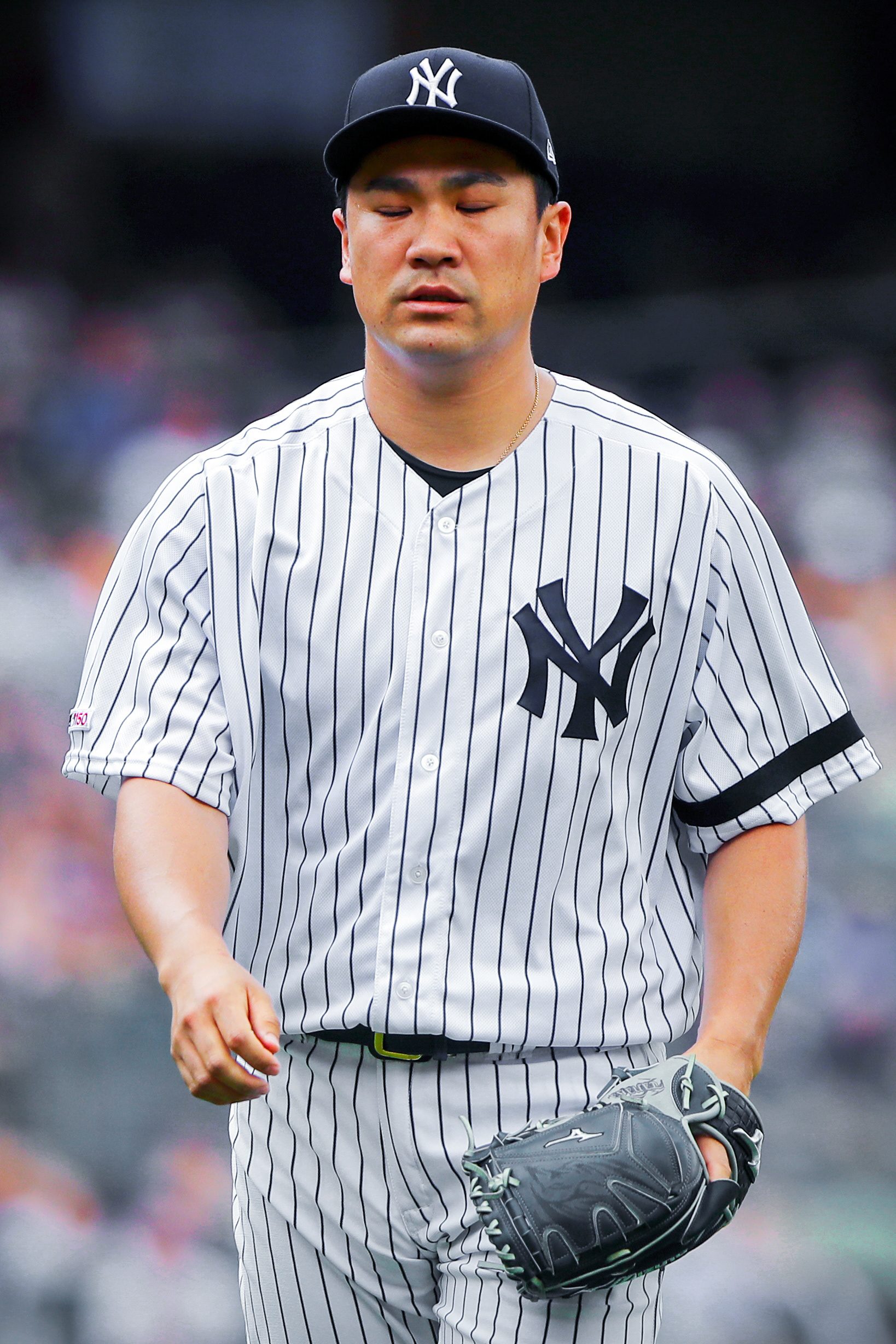 Masahiro Tanaka #19 of the New York Yankees reacts to being taken out of the game during a game between the Arizona Diamondbacks and the New York Yankees at Yankee Stadium on Wednesday, July 31, 2019 in the Bronx borough of New York City.