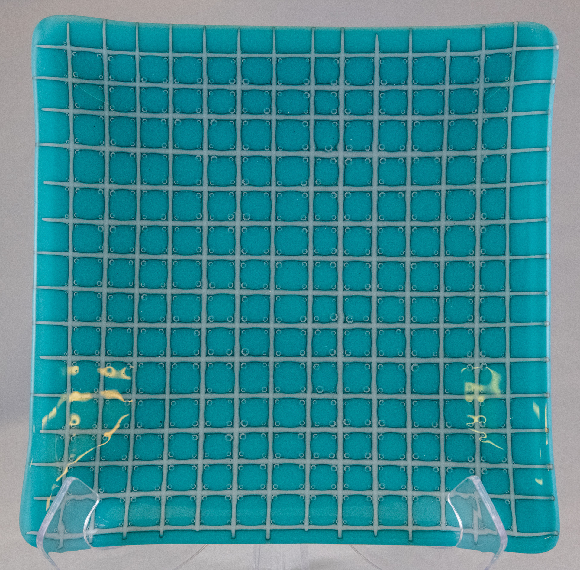 I began taking classes at The Craft Guild of Dallas in January 2025.  In fused glass, you normally want to avoid creating bubbles.  This project, however, is intended to create bubbles that are trapped within each square in the grid of stringers.