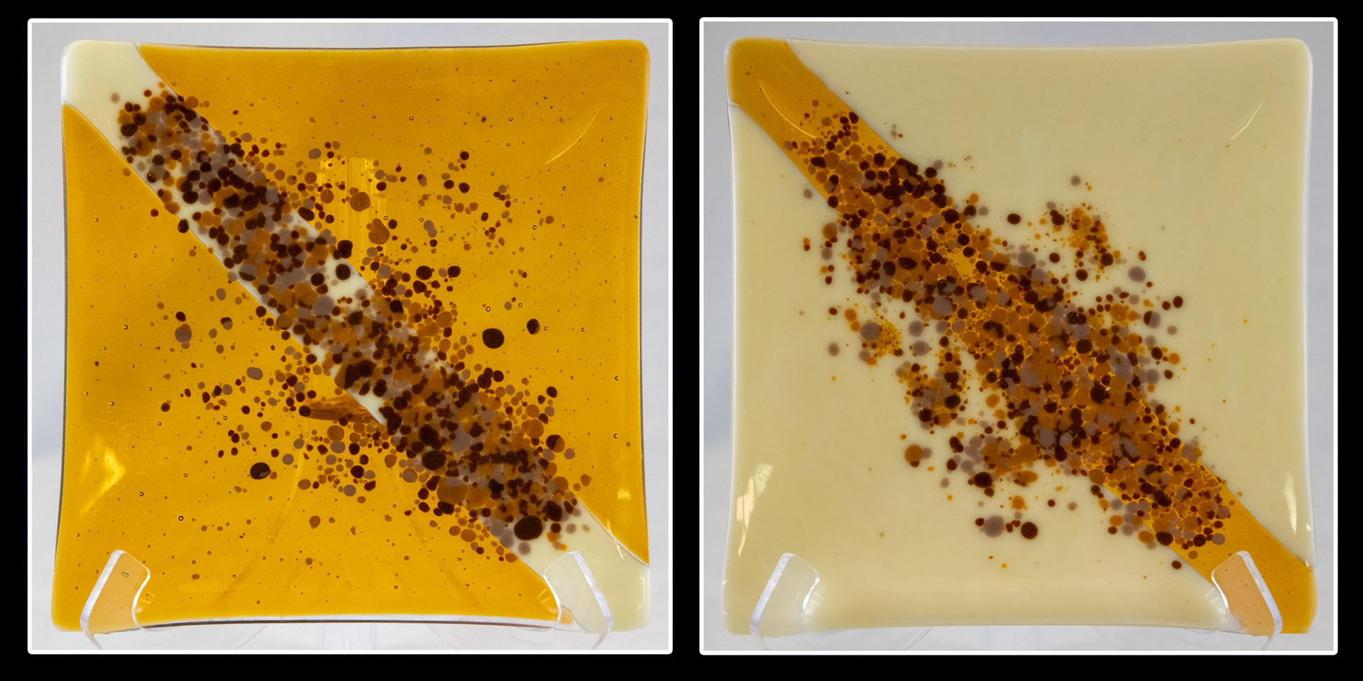 These plates were created as opposites of each other.  The left plate uses medium amber glass with a stripe of French vanilla in the center.  The right-hand plate has French vanilla with a stripe of medium amber in the middle.  Both have "artisanal  frit" decorating the center stripe and surrounding area.  Artisanal frit is frit that I made from scraps of sheet glass.