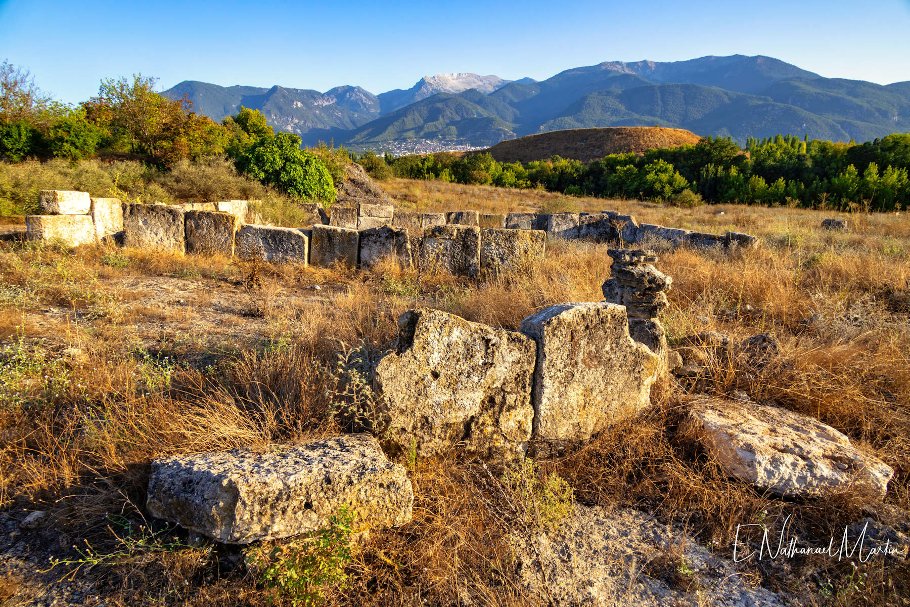 Ruins of an ancient church with the unexcavated mount of Colossae behind.