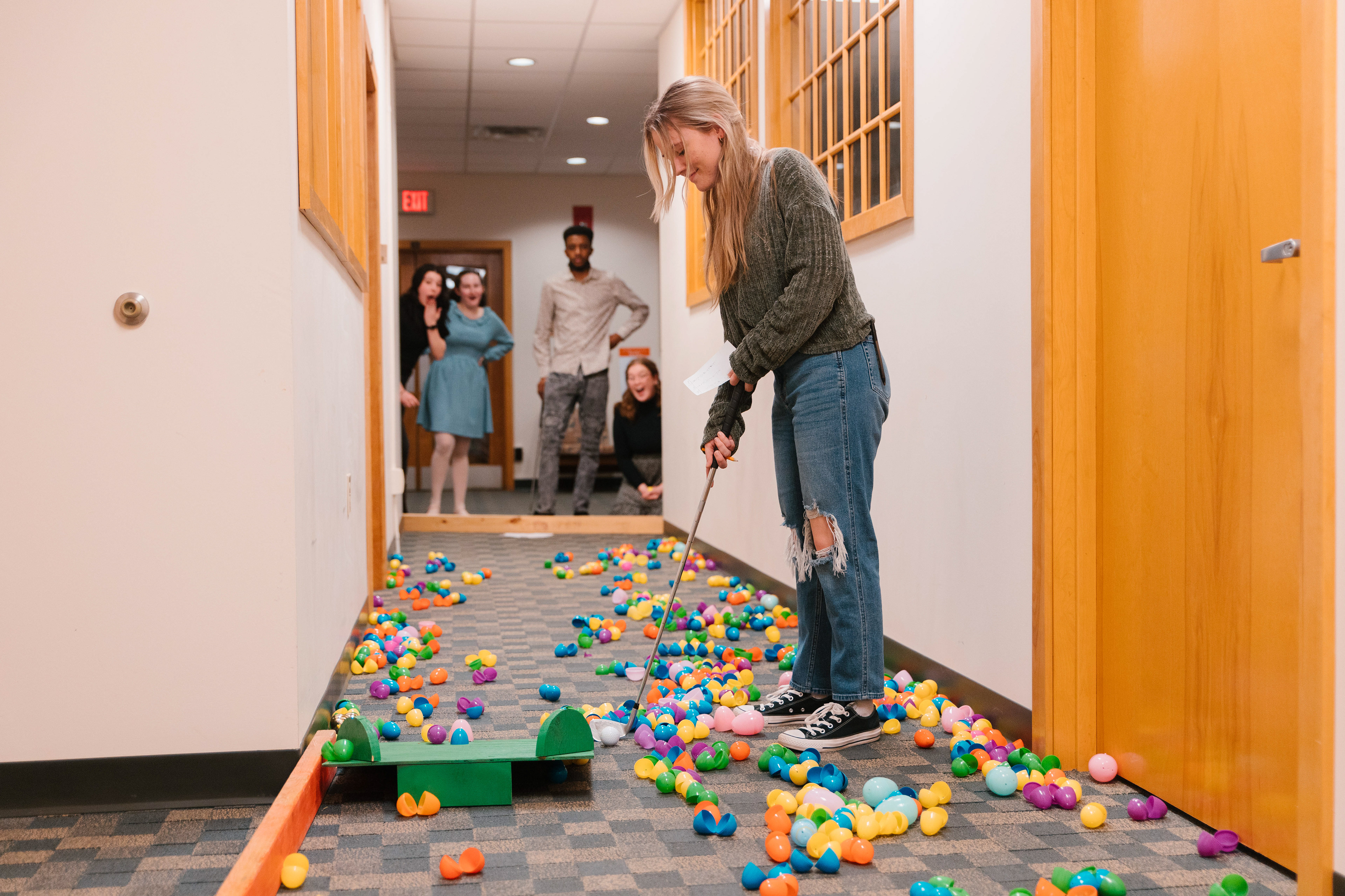 Holly plays mini-golf in the library