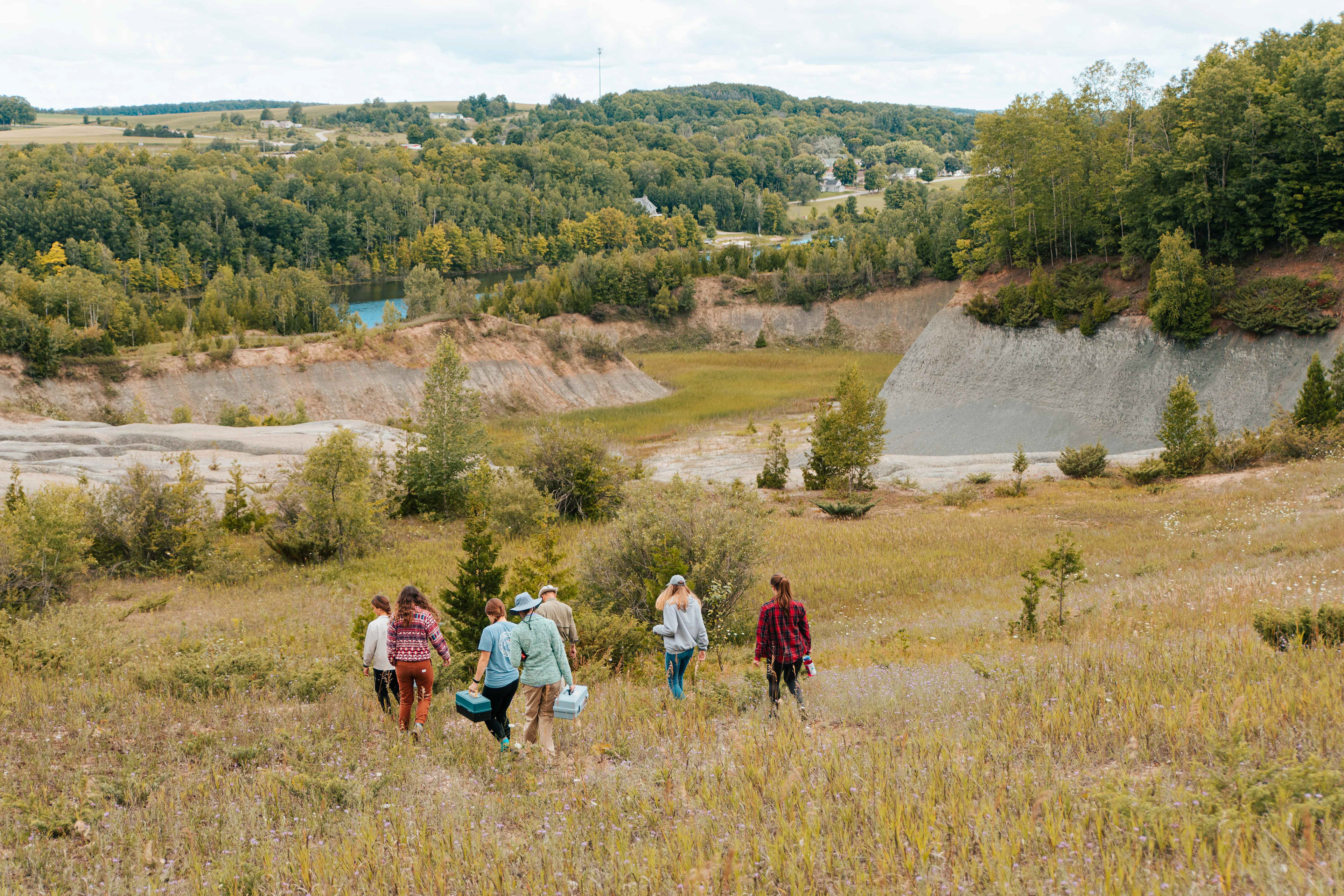 The class tests the chemistry at various levels of an old shale quarry.