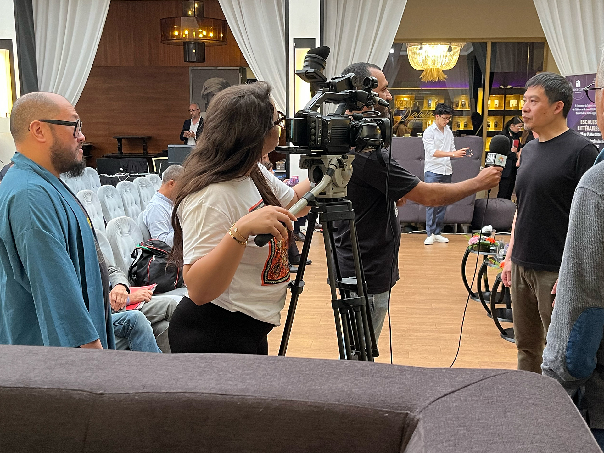 Sean Chen is interviewed by the Moroccan TV Show as Bernard Chang waits his turn.