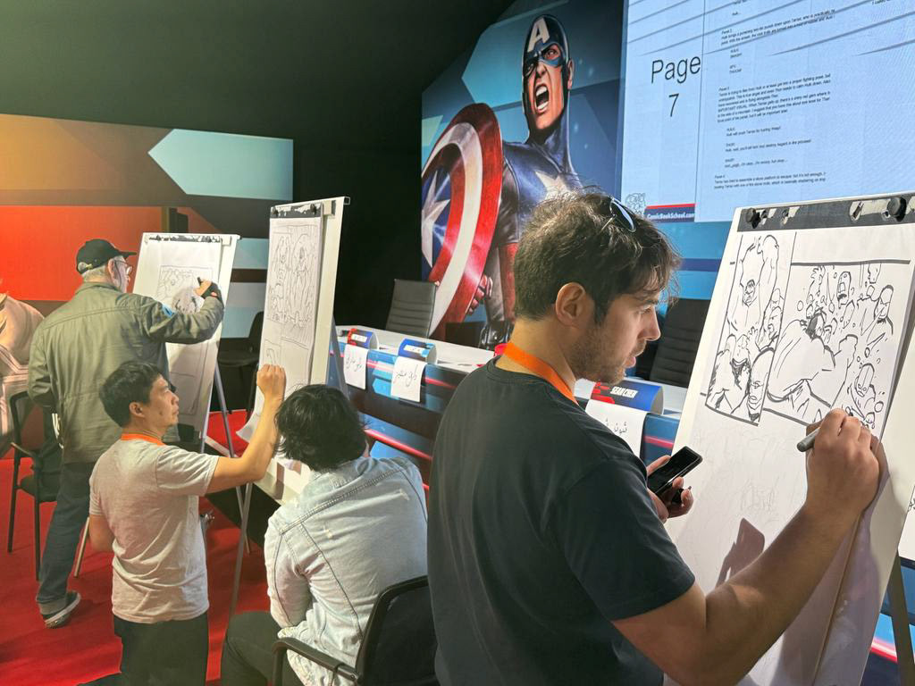 Ariel and Mario demonstrate their skills drawing page layouts