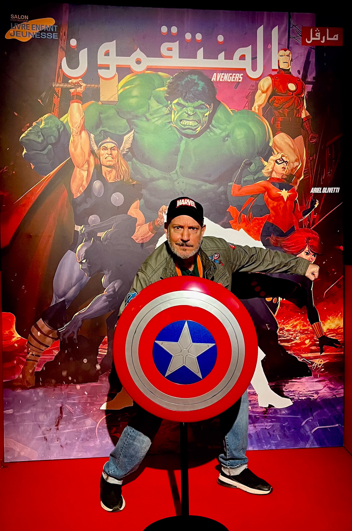 Ariel Olivetti poses with his life-sized cover of the Avengers