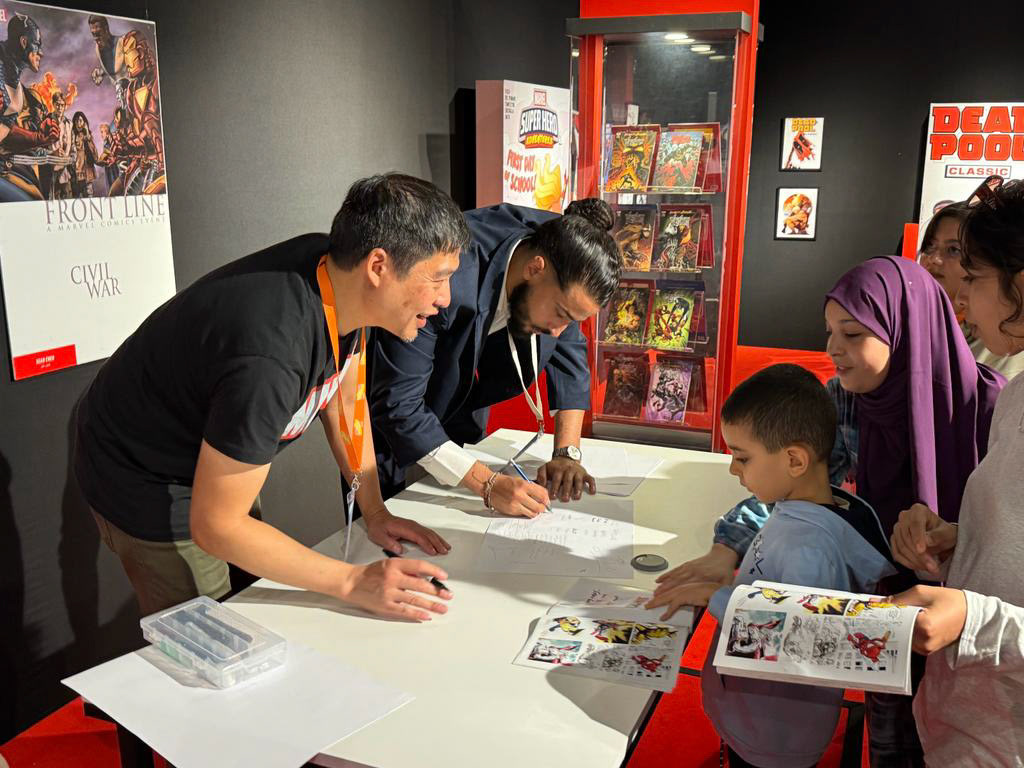 Sean Chen was surrounded by kids for hours.