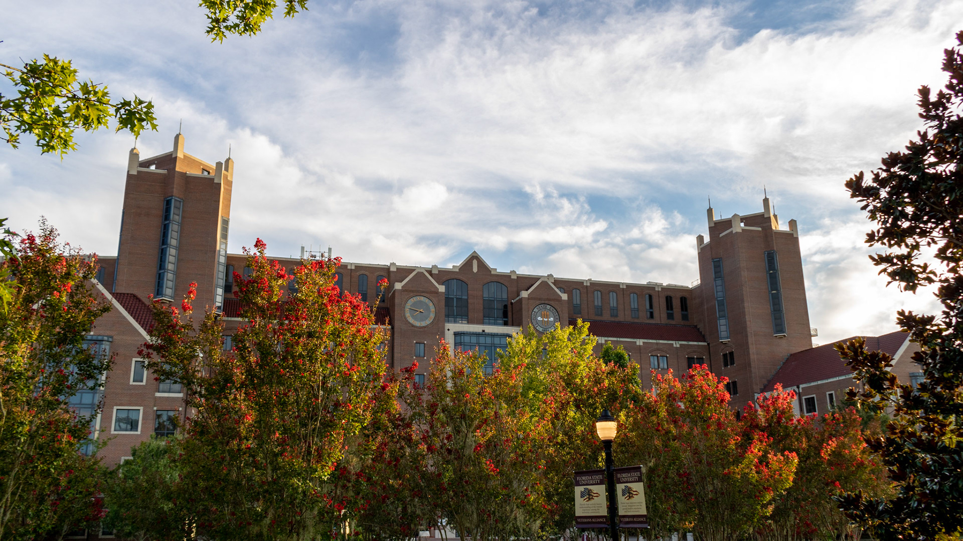 Doak Campbell Stadium with Red Flowers
