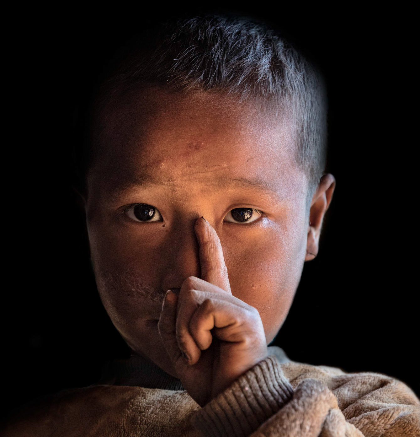 One of the small children in the tribe staring at me in wonderment