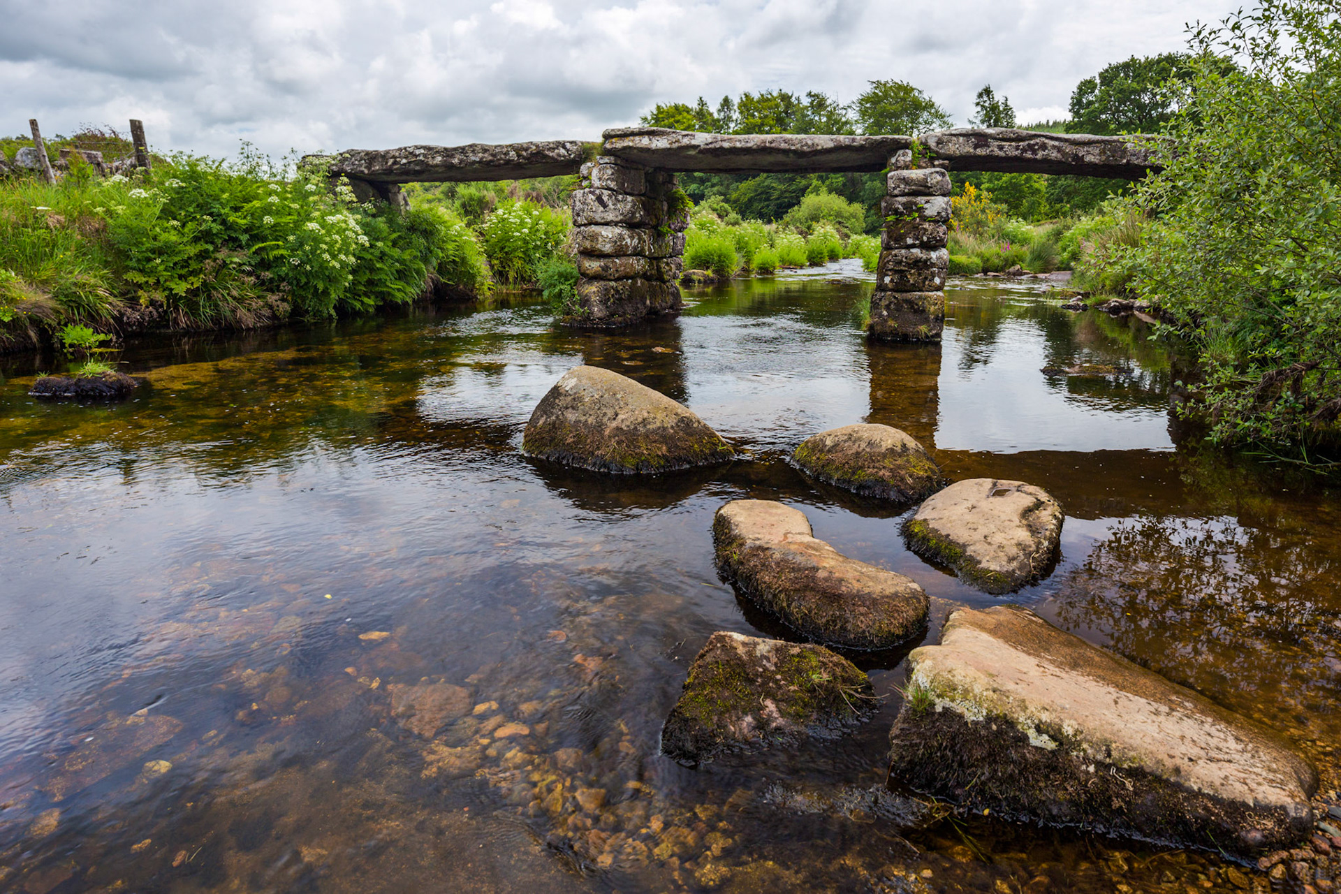 Postbridge clapper bridge, the only complete clapper bridge over the East Dart River in Dartmoor National Park.