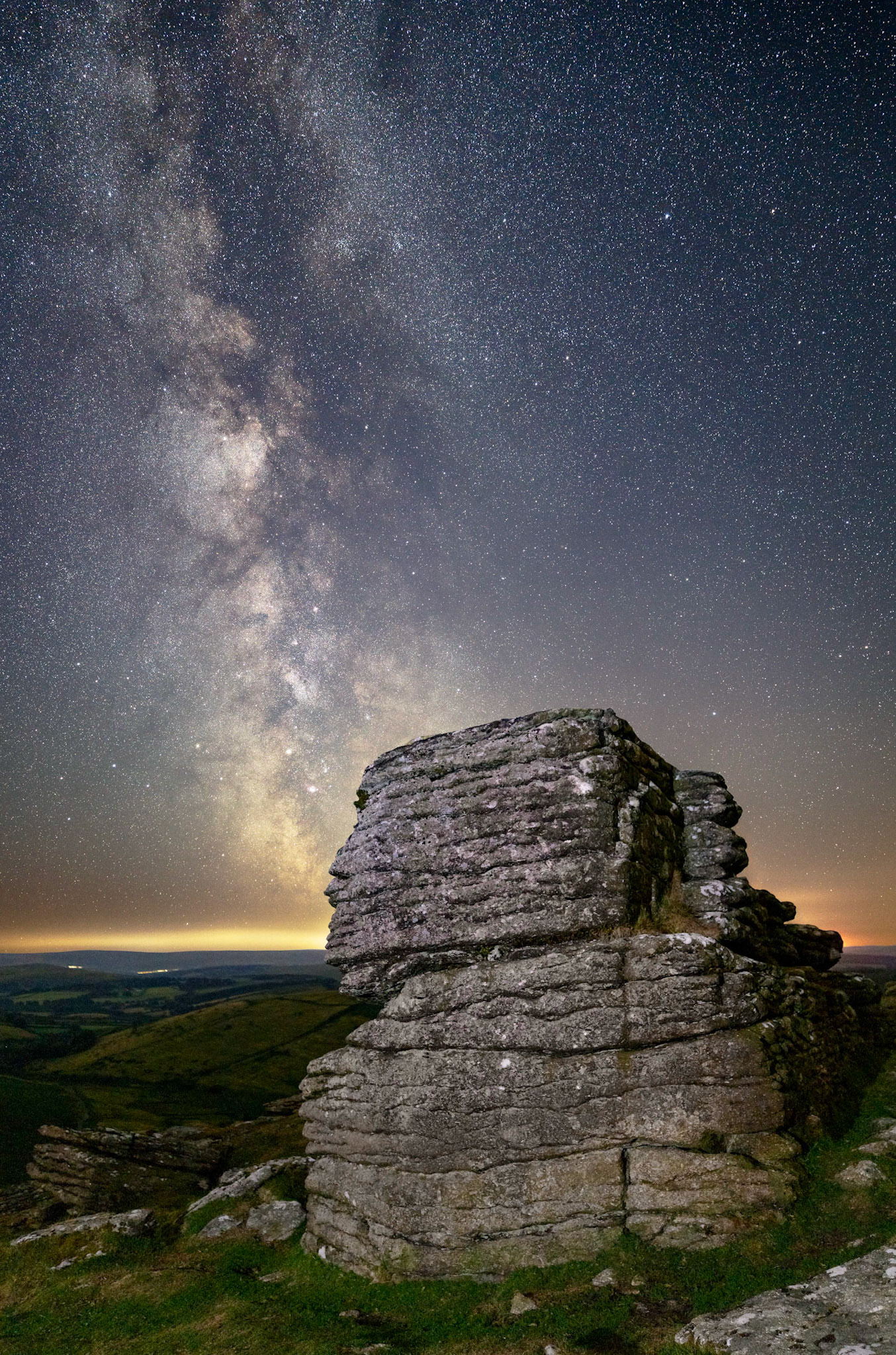 The Milky Way on a clear night sky over Hookney Tor in Dartmoor National Park.