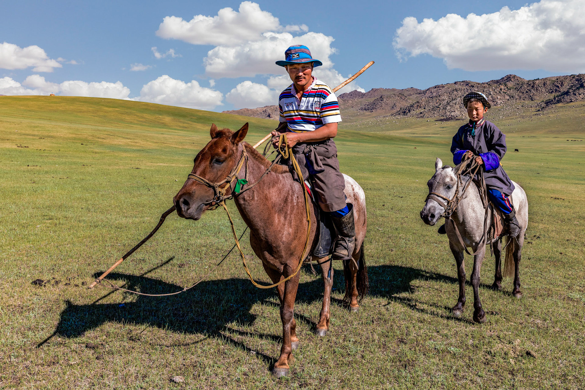 Father and son, part of the extended nomadic family that lives nearby in the grasslands of Mongolia.