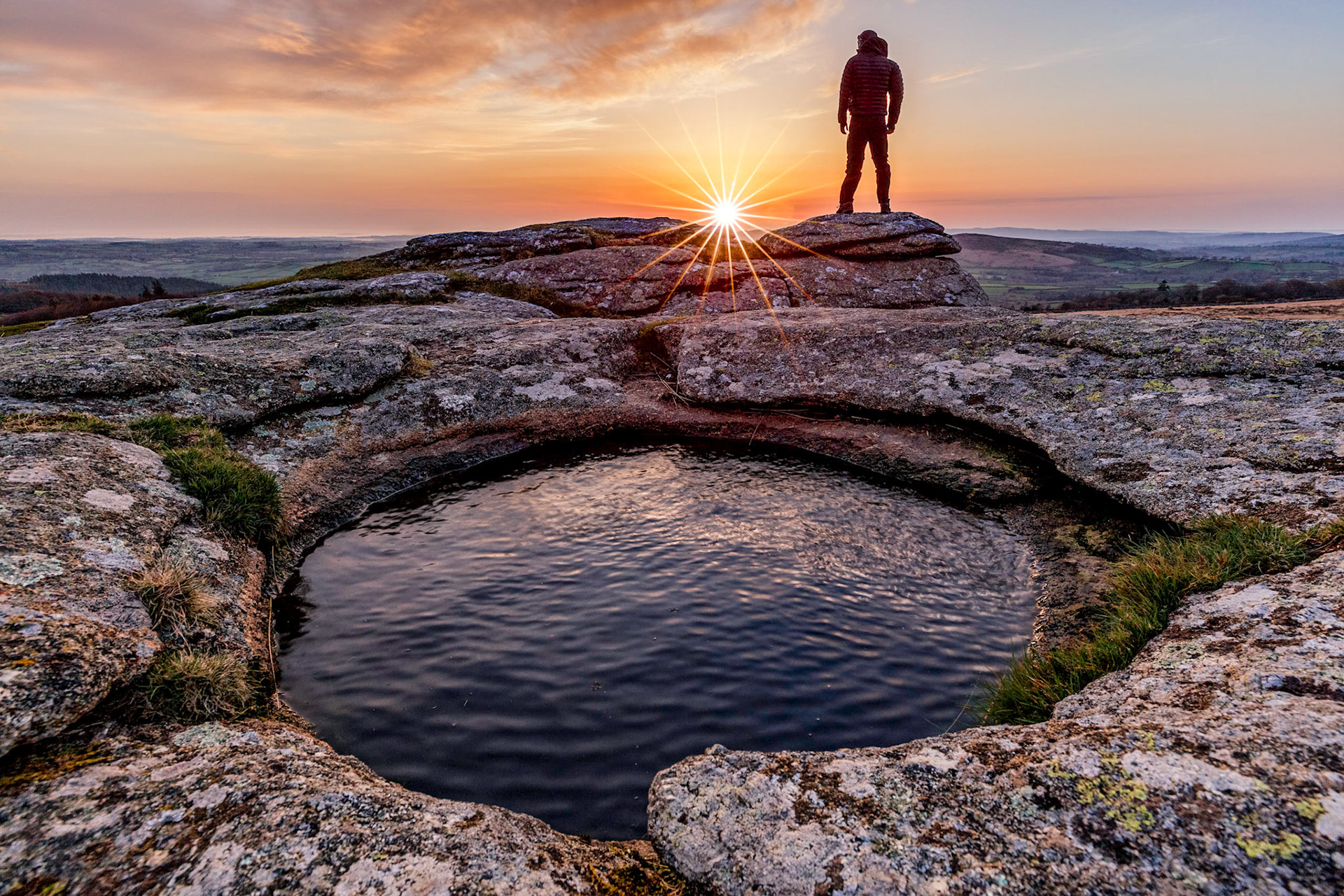 Self portrait standing on Kestor Rock in Dartmoor national park at Sunrise.
