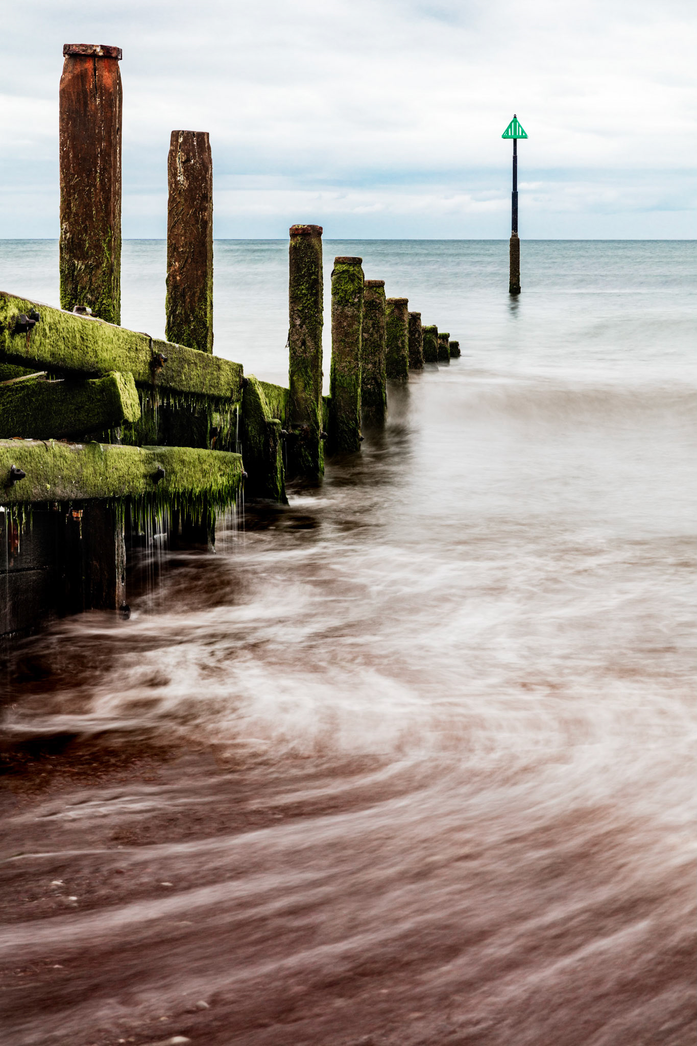 The flowing waves on coast in Teignmouth, Devon.