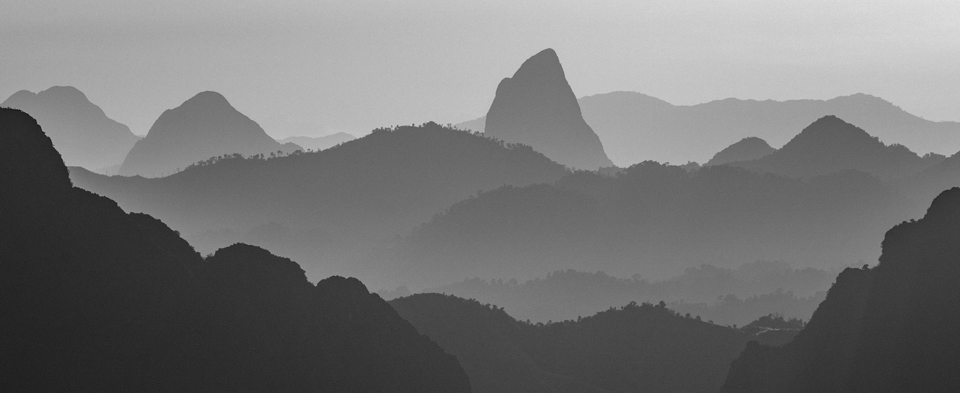 Varying shades of light on the various mountains near Vang Vieng, Laos.