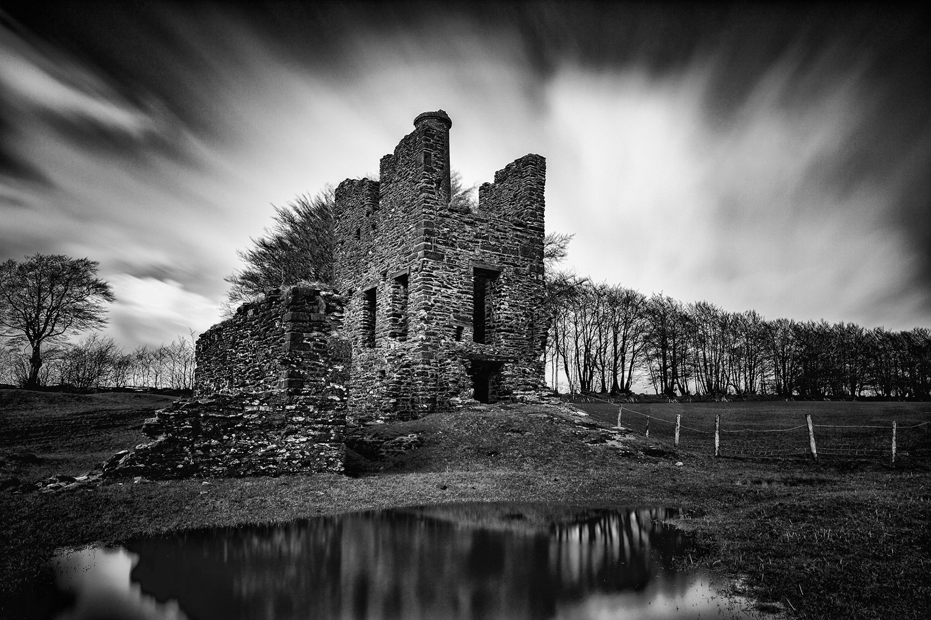 Burrow Farm Engine House, An engine house for a Cornish pumping engine, built approximately 1860 at Burrow Farm Mine by Henry Skewis, Mines Captain. It has an associated drying shed to the west, used for drying miners' clothing.