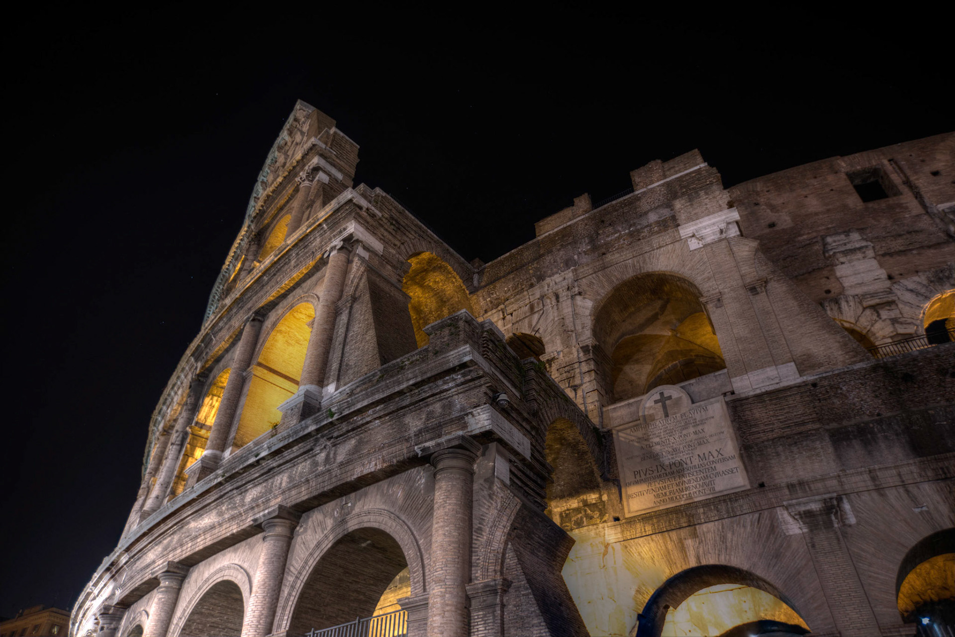 The layers of the Colosseum lit up at night