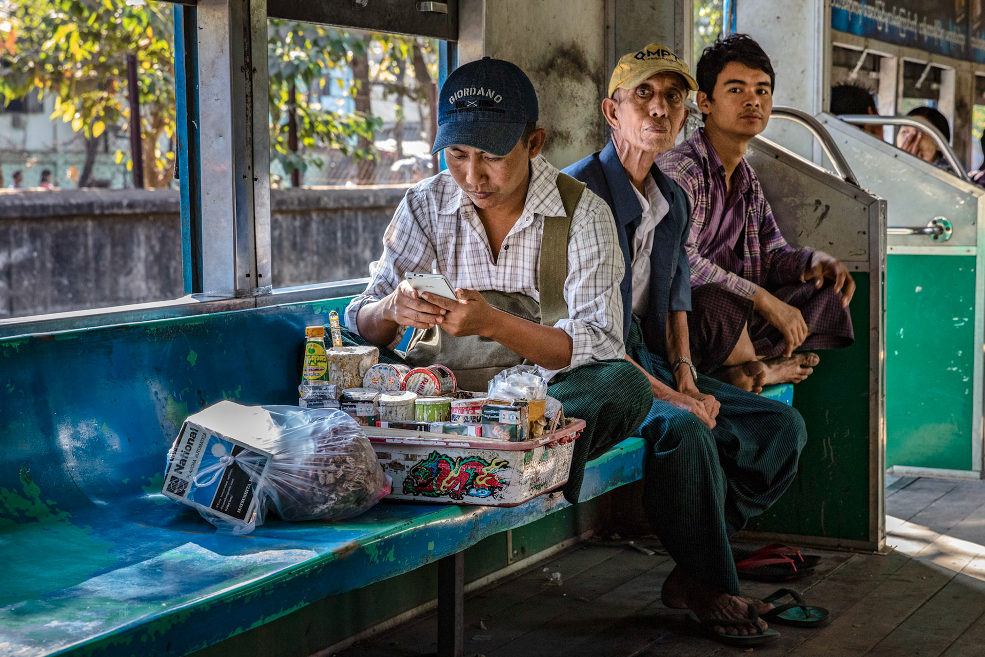 Burmese locals on the circular train in Yangon, Myanmar.