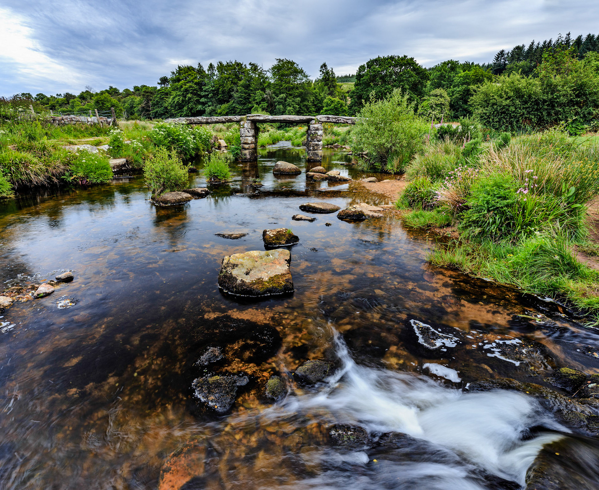 The only complete clapper bridge over the East Dart River in Dartmoor National Park.