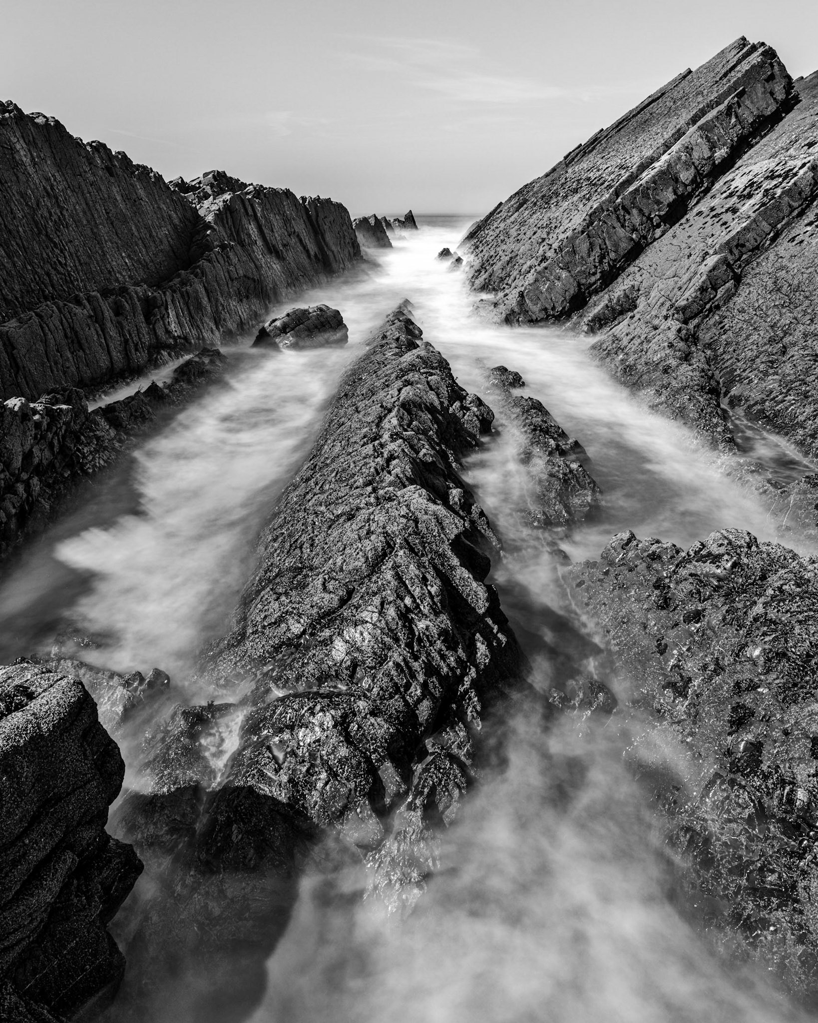 The sandstone and slate folds of North Devon as the point you out to the sea near Blackpool beach.