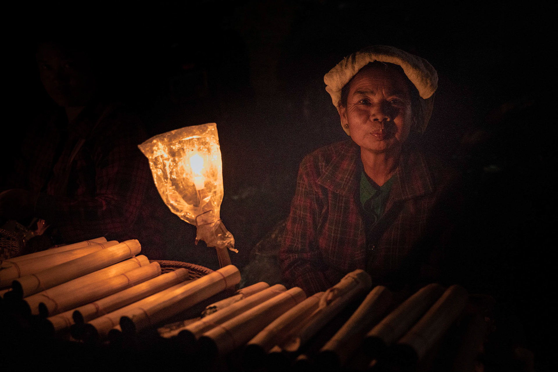 Burmese woman selling sweet sticky rice at a new year celebration in Keng Tung, Myanmar.