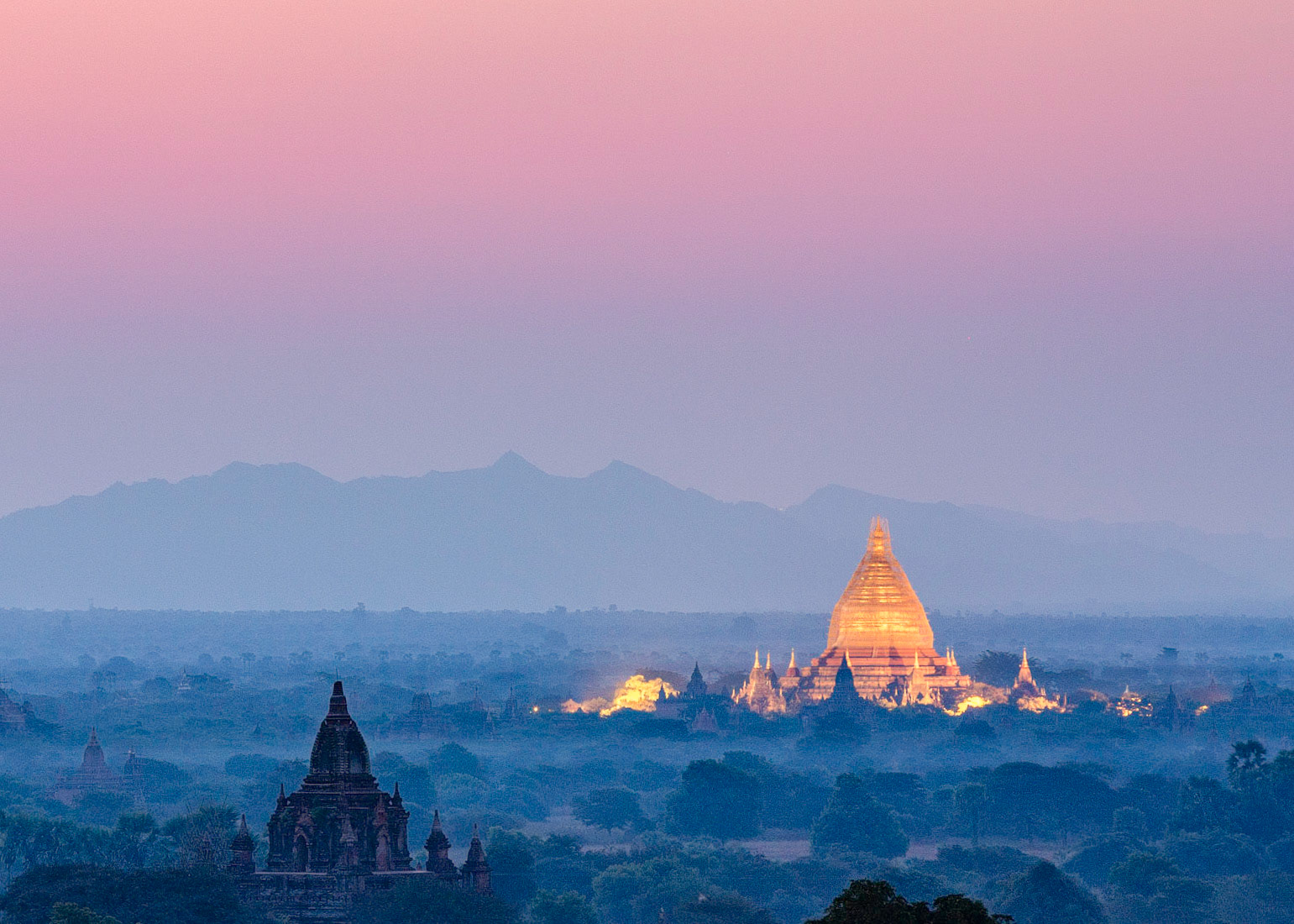 Dhammayazika Pagoda illuminated by flood lights during the early morning hours in Bagan, Mandalay.
