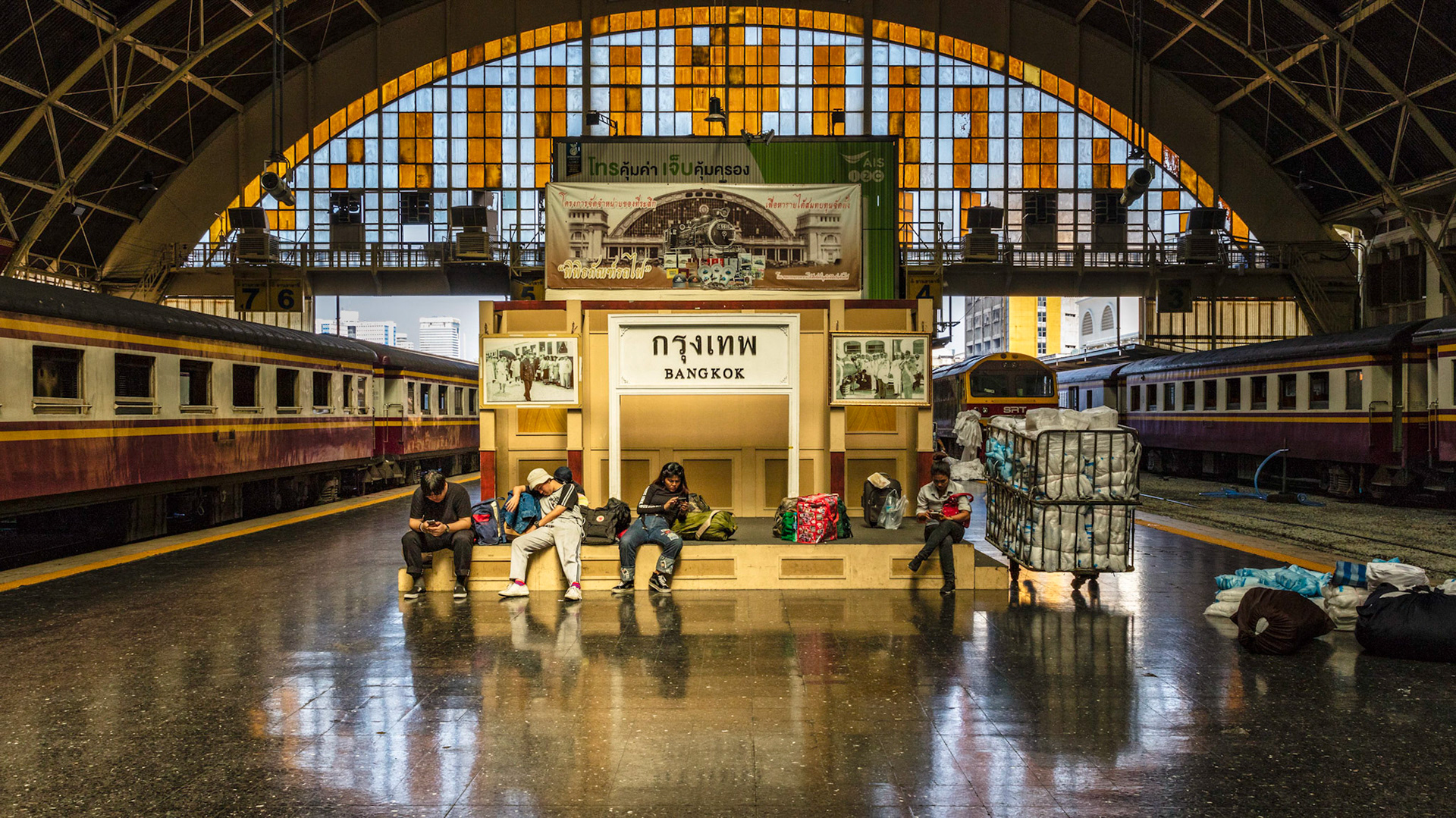 Passengers waiting for their train in a train station in Bangkok, Thailand