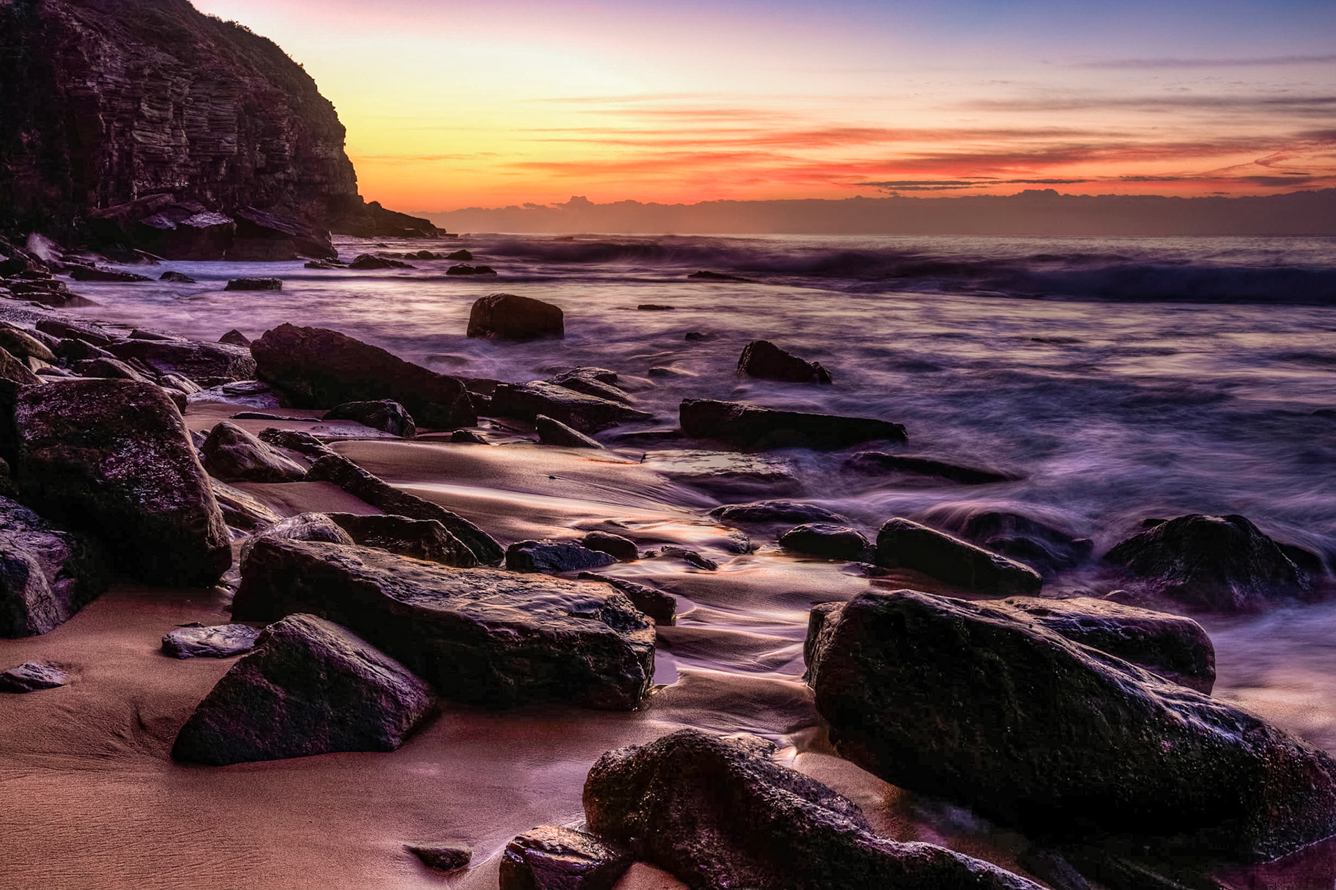 Early Morning on the western coast of Austrailia (a little north of Sydney) the waves roll over the rocks on this early winter morning