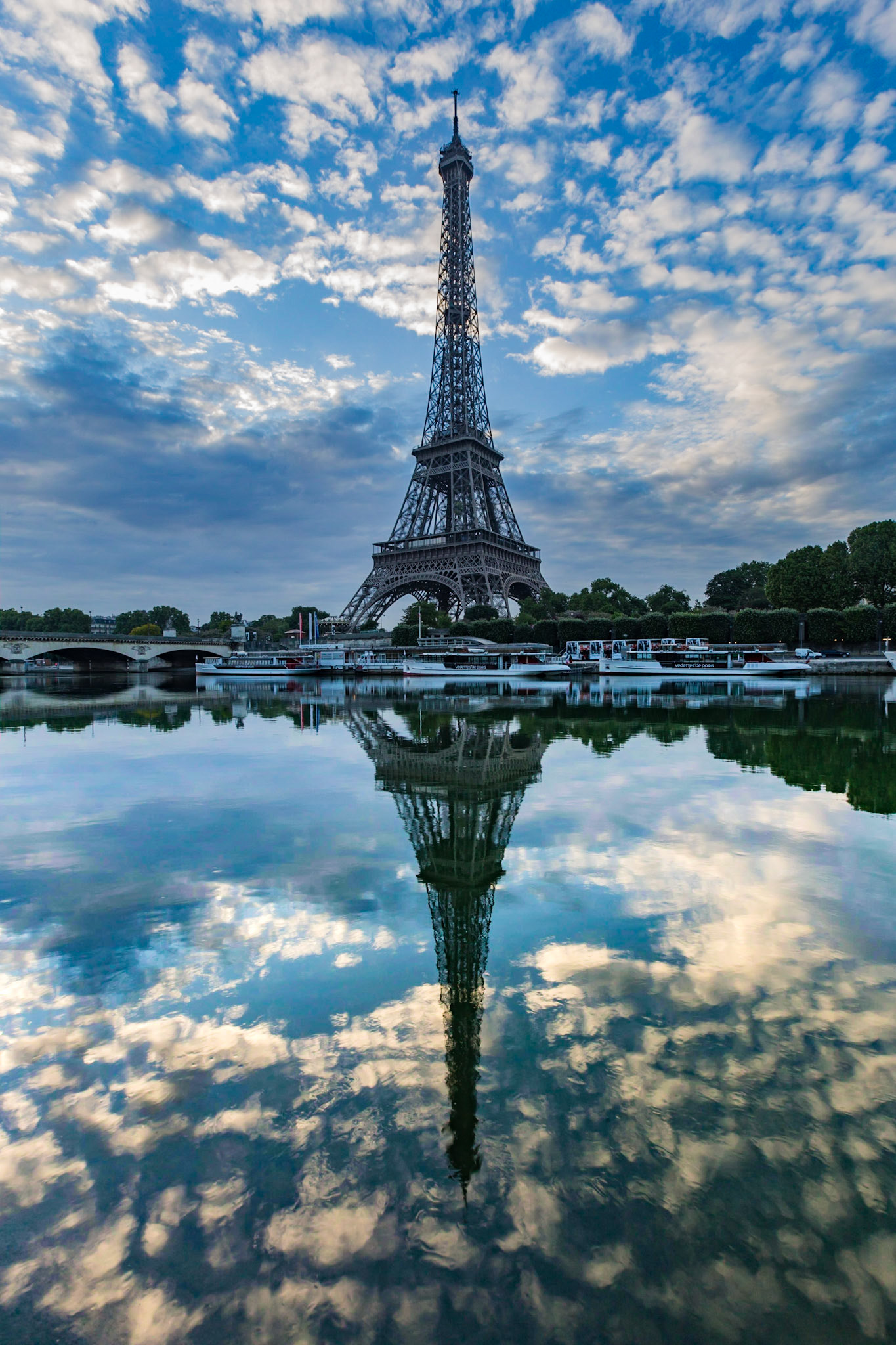 An almost still river giving me a nice reflection of the tower and clouds from across the river
