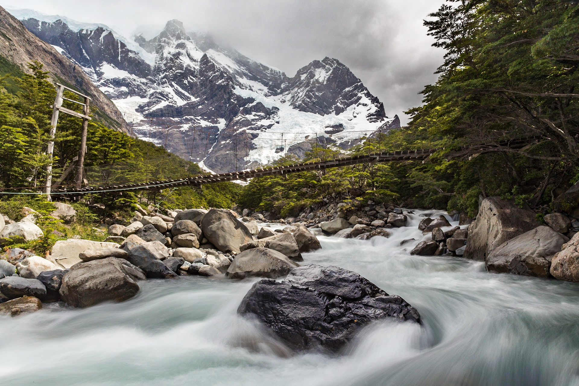 One of the bridges over the roaring river flowing through the French Valley of Torres del Paine