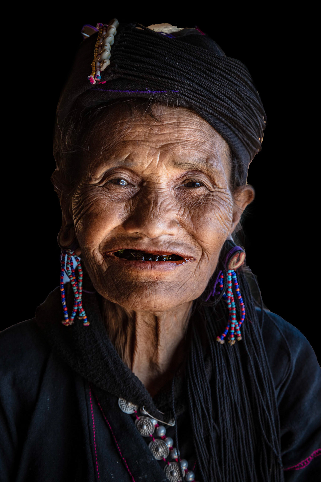 Elderly women of the Ann tribe who invited us to see her family's home and drink some tea near Kangtung, Myanmar.