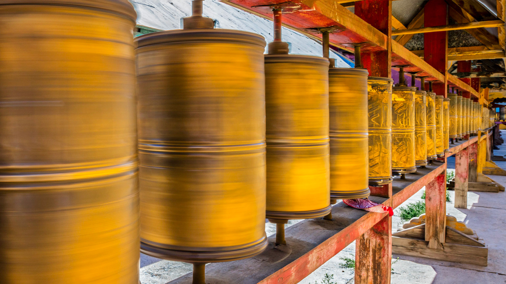 Showing the prayer wheels in motion near the Gandantegchinlen Monastery in Ulaanbaatar, Mongolia