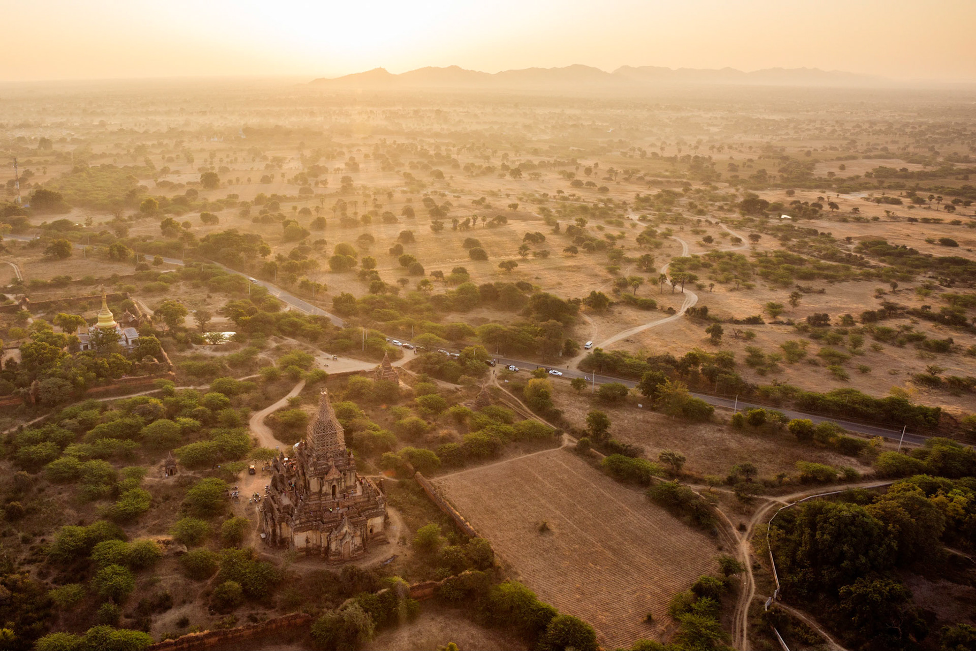 The early morning sun illuminating the pagoda's and surrounding countryside in Bagan, Myanmar.