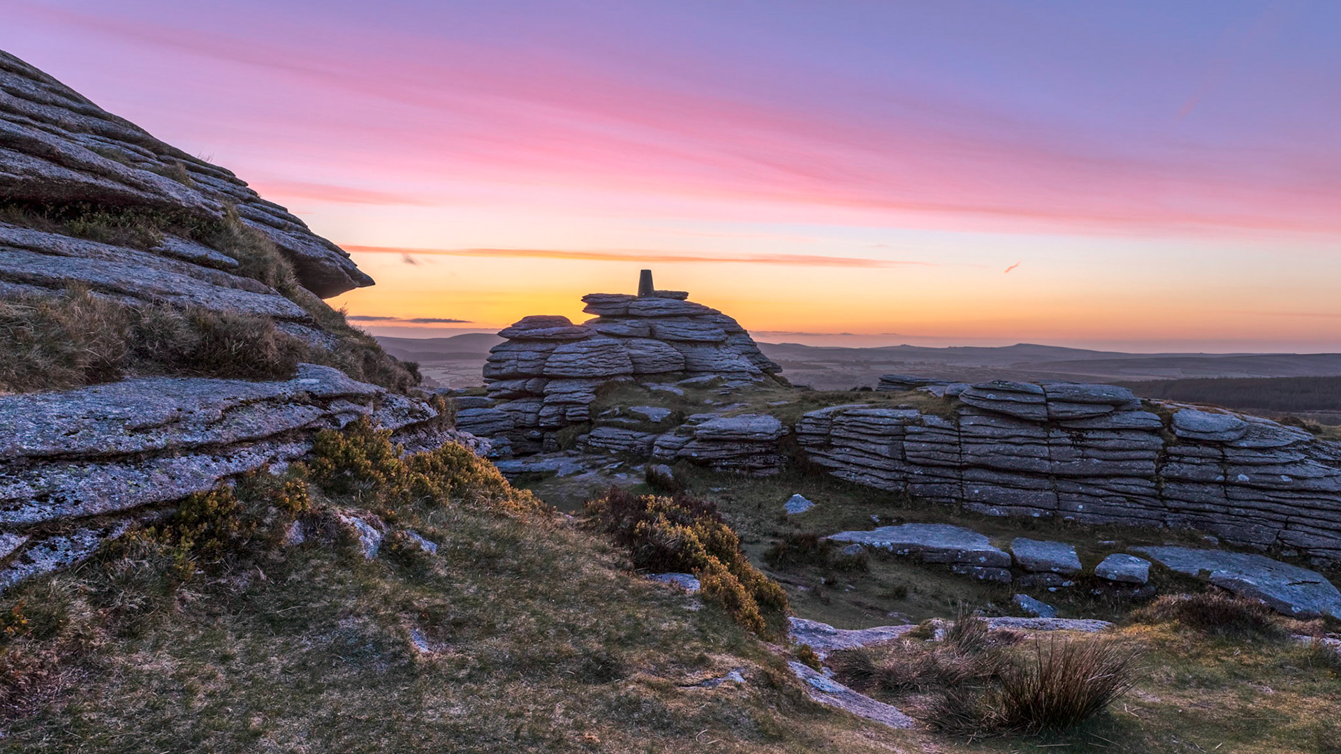 Just before sunrise on Bellever Tor as the sun gently illuminates the wispy strands of cirrus clouds.