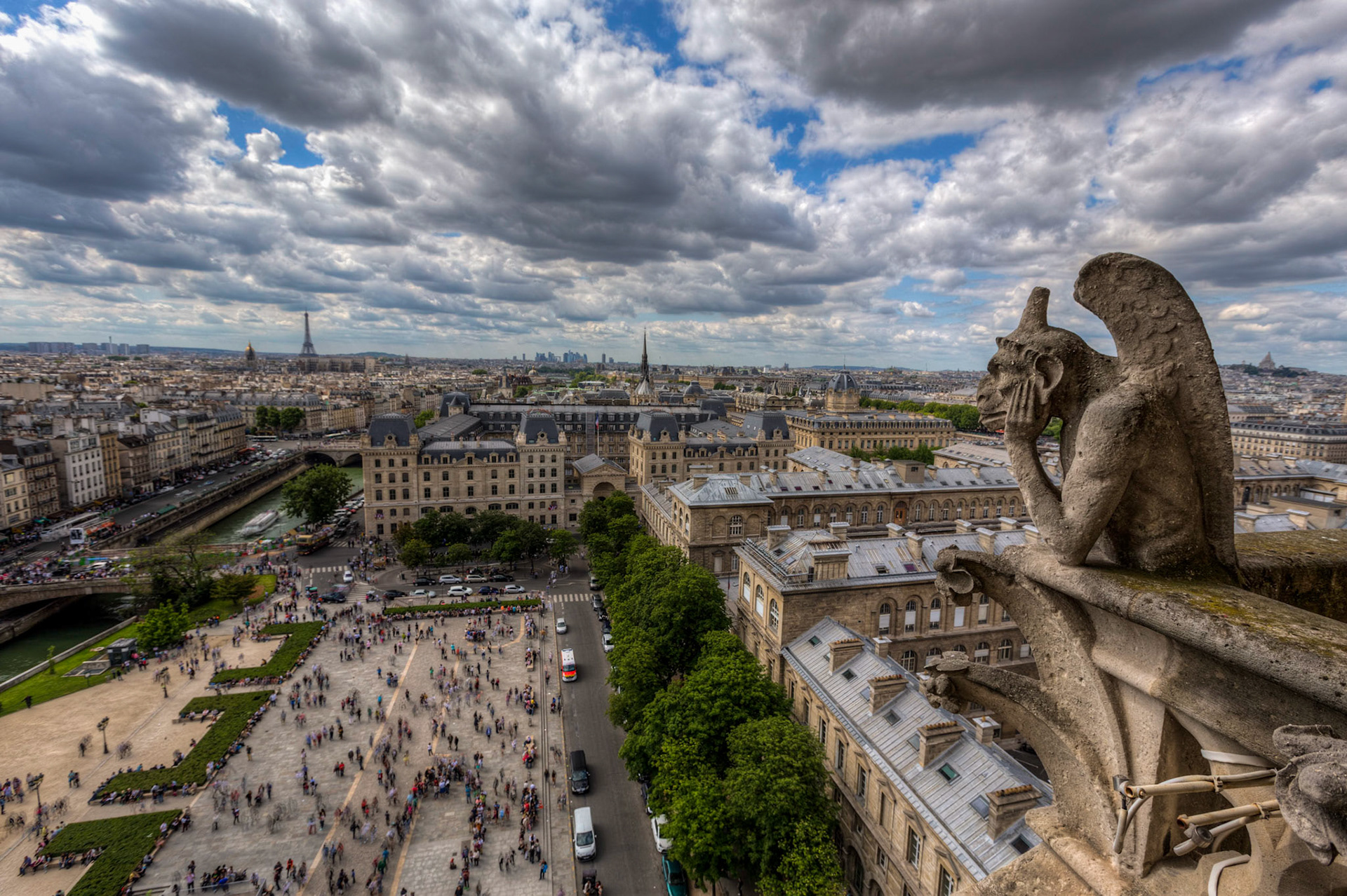 One of the gargoyals sitting on top of Notre Dame in Paris, France