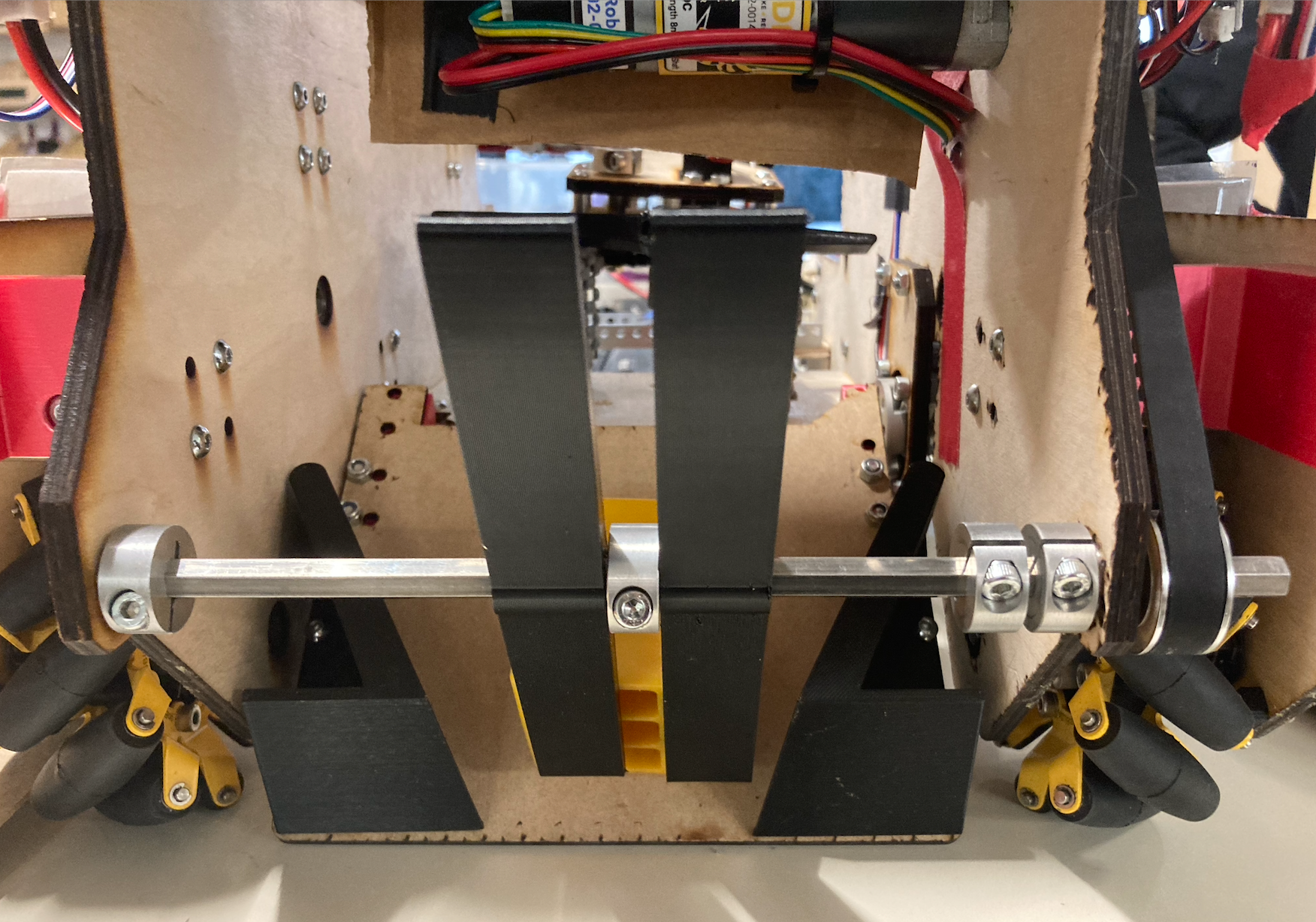 This picture shows the final version of our intake, made out of 3D-printed TPU flippers (TPU is a flexible material).