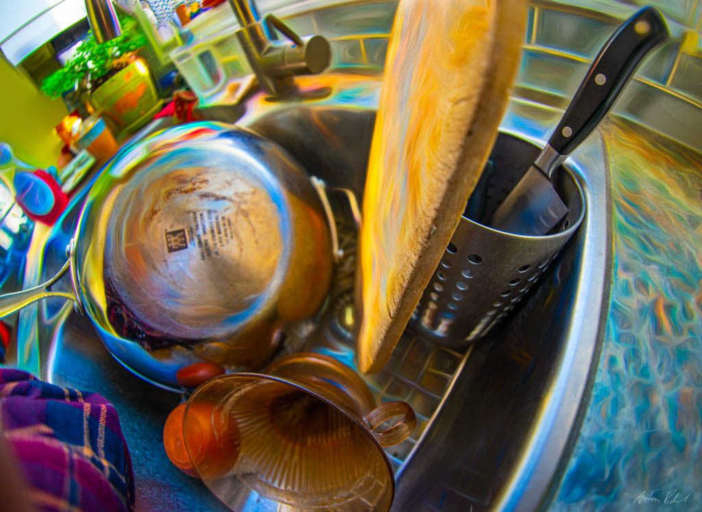 photo with a fisheye lens of dishes in a sink